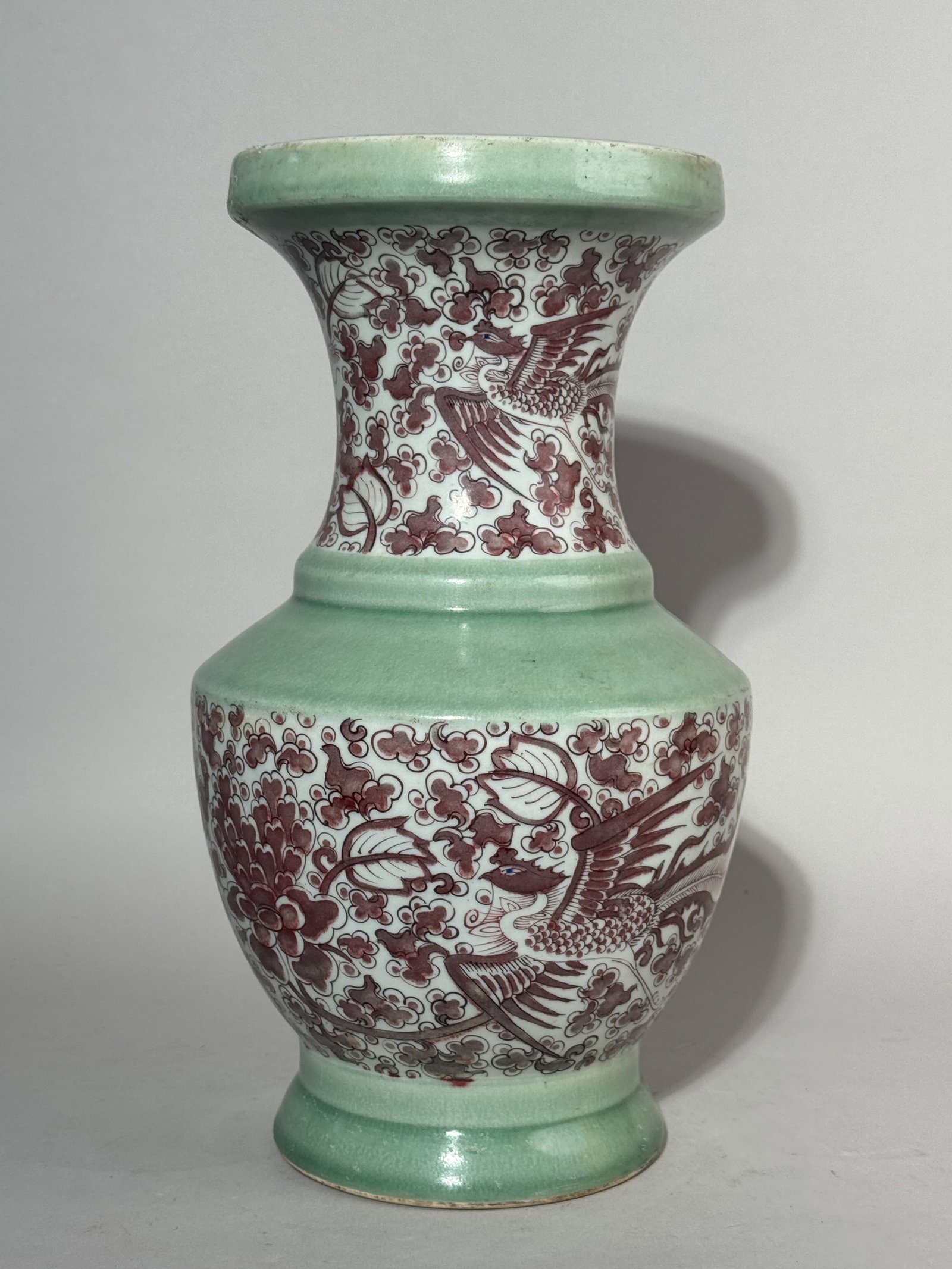 CHINESE PORCELAIN YENYEN VASE WITH COPPER-RED PHOENIX SCENE: A Chinese yenyen-shaped porcelain vase with an underglaze copper-red phoenix scene, bottom with a six-character mark. Dimensions: Height: 13.25 in. (33.7 cm). Note: This item is in New York, where it 