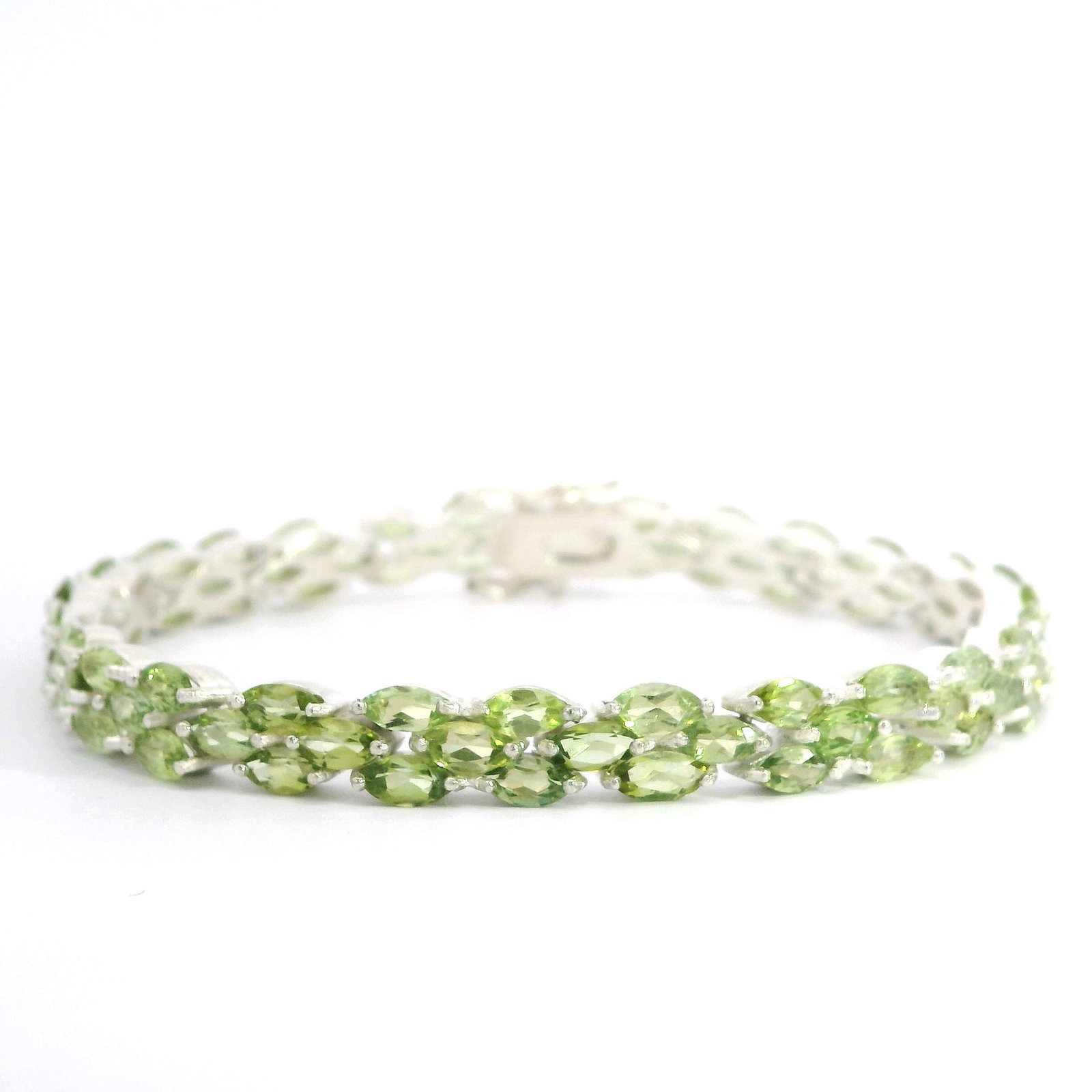GREEN TOURMALINE MARQUISE BRACELET OVER STERLING SILVER: Green tourmaline marquise bracelet over sterling silver. 7.48"l x 0.28"w (19 x 0.7 cm)