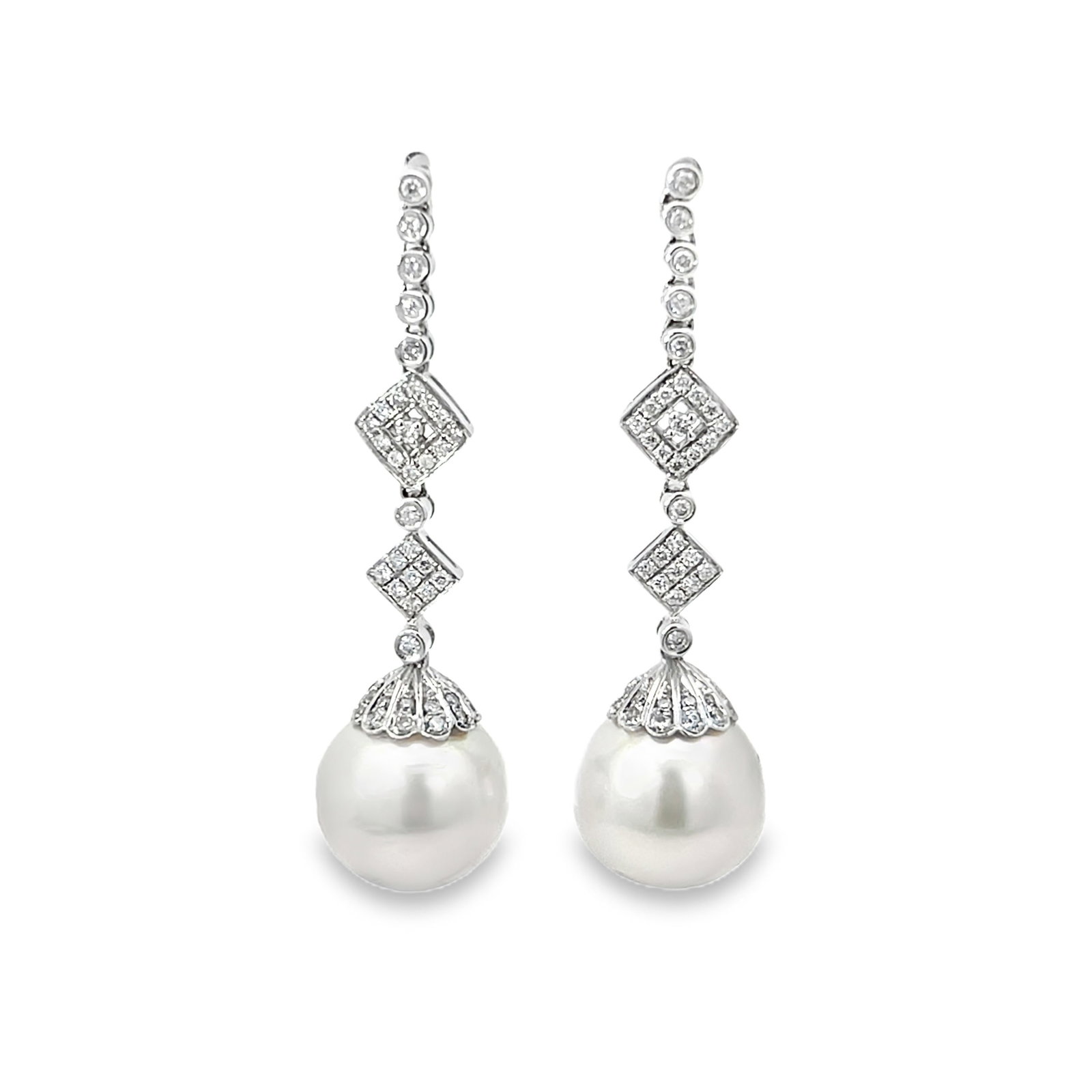PEARL, DIAMOND AND 18K WHITE GOLD EARRINGS: Pearl, diamond and 18K White gold earrings. 1.97"h x 0.31"w (5 x 0.8 cm); pearl: 0.31"d (0.8 cm)