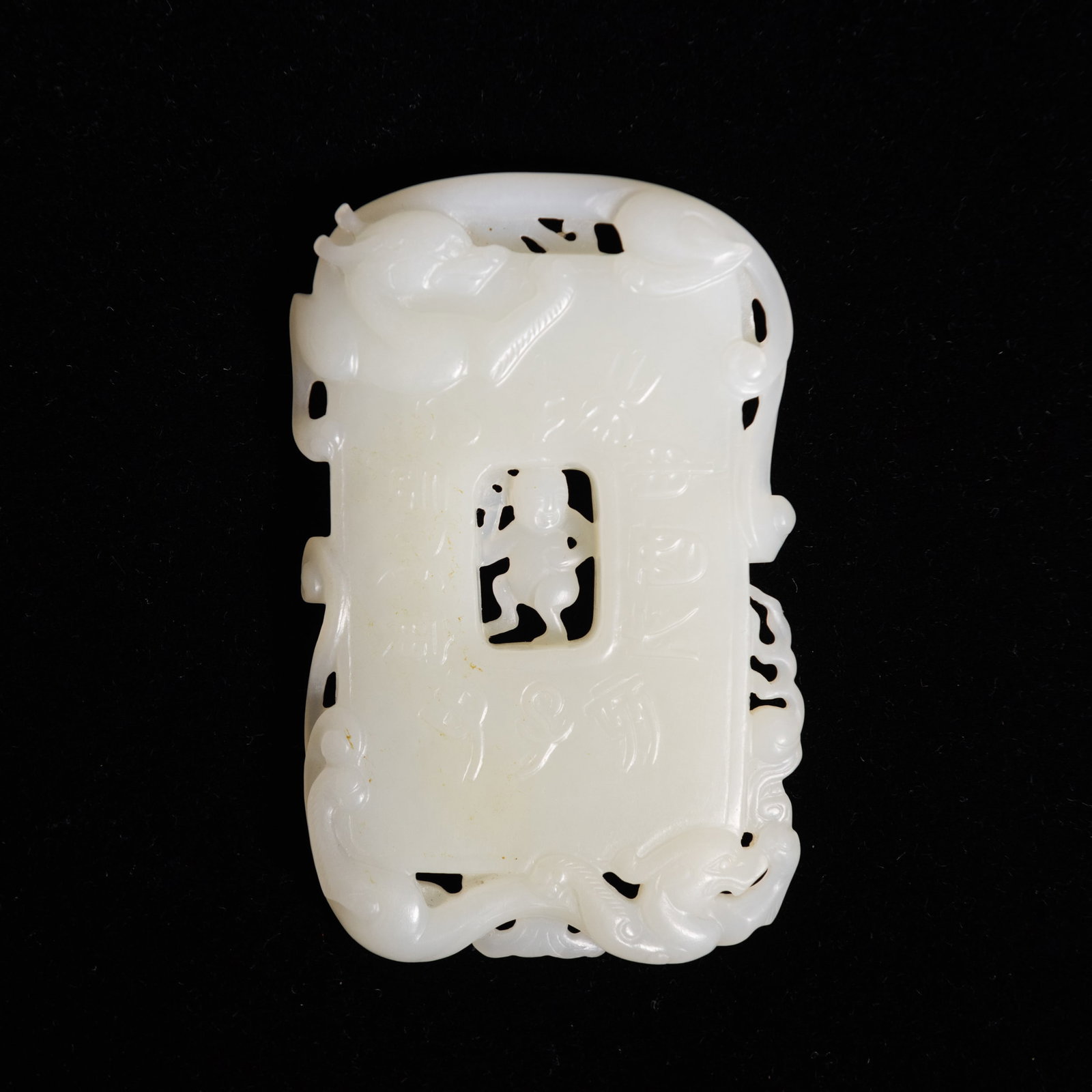 A CHINESE CARVED WHITE JADE PLAQUE: A Chinese carved white jade plaque. 3.46"h x 2.17"w x 0.31"l (8.8 x 5.5 x 0.8 cm)