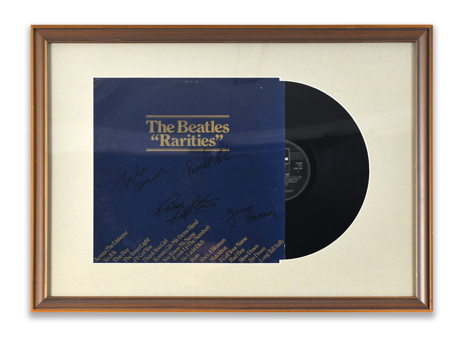 THE BEATLES FRAMED ALBUM DISPLAY "RARITIES", BEARING SIGNATURES: A framed album display for "Rarities". The display bears multiple ink marks.