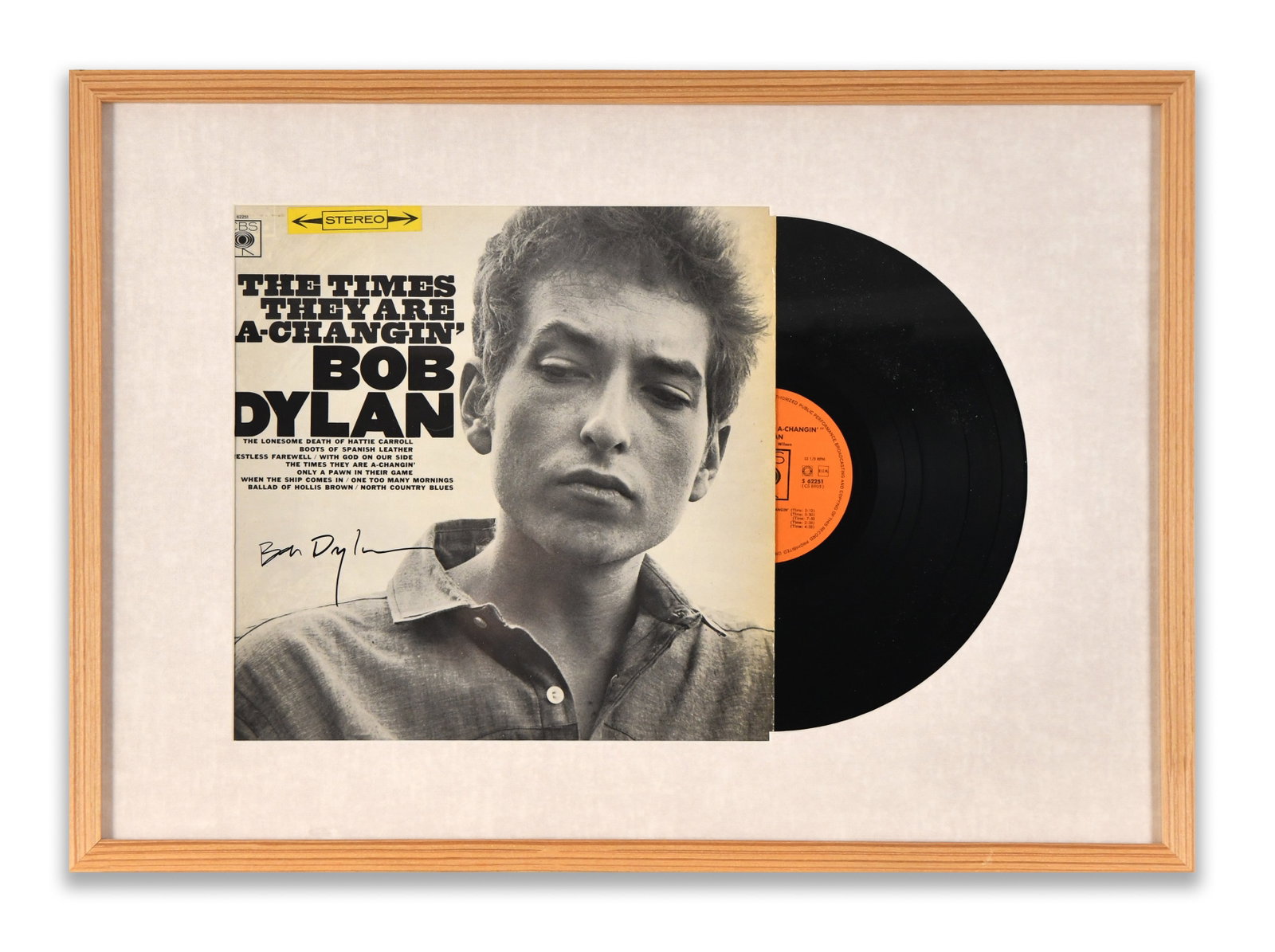 BOB DYLAN FRAMED LP DISPLAY "THE TIMES THEY ARE A-CHANGIN'", BEARING SIGNATURE: A framed LP display for "The Times They Are A-Changin'". The display bears an ink mark.