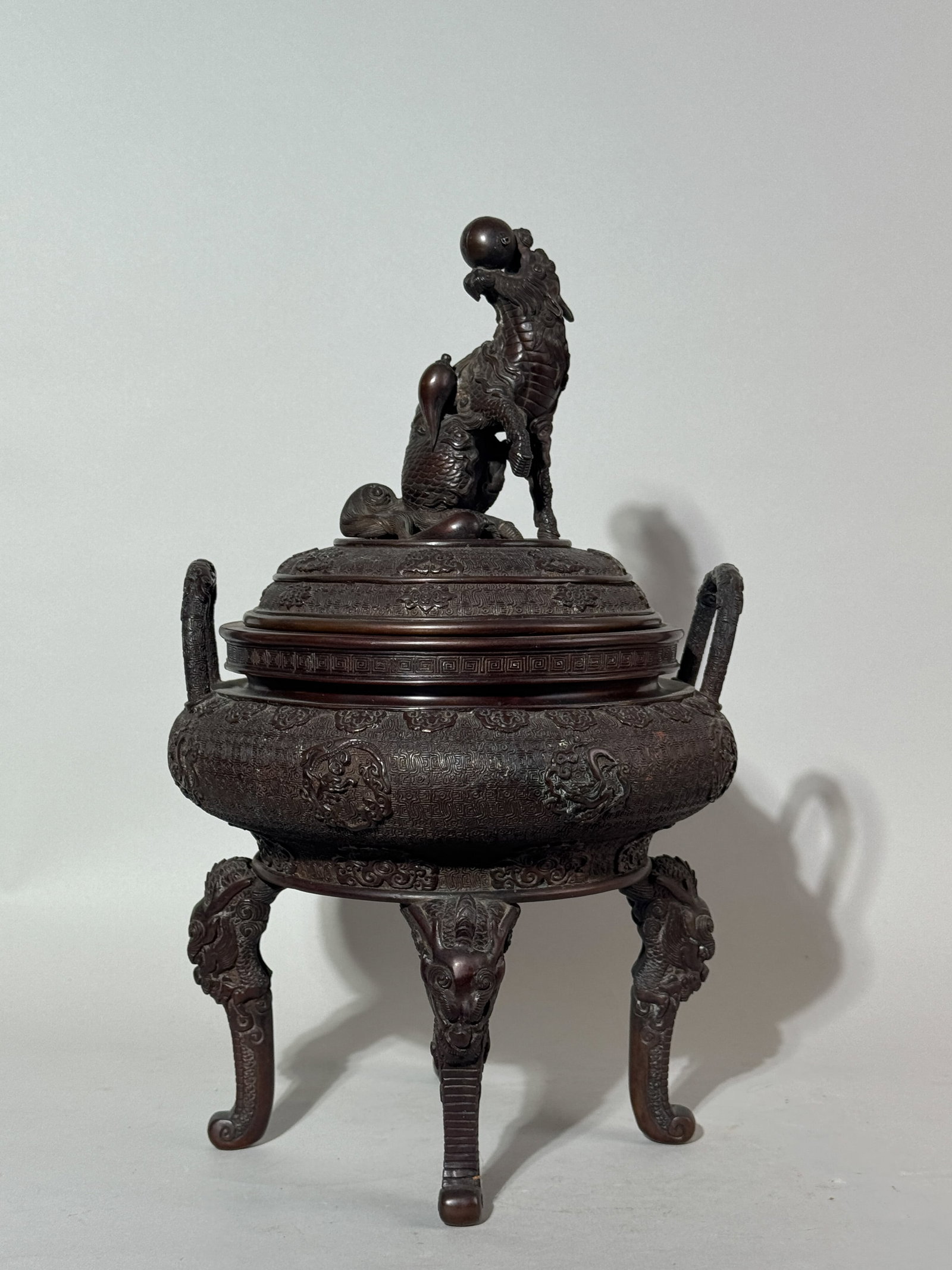 JAPANESE MEIJI BRONZE CENSER WITH KIRIN: A Japanese Meiji period bronze censer with a kirin finial, signed. Dimensions: Height: 16 in. (40.6 cm). Note: This item is in New York, where it can be shipped from.