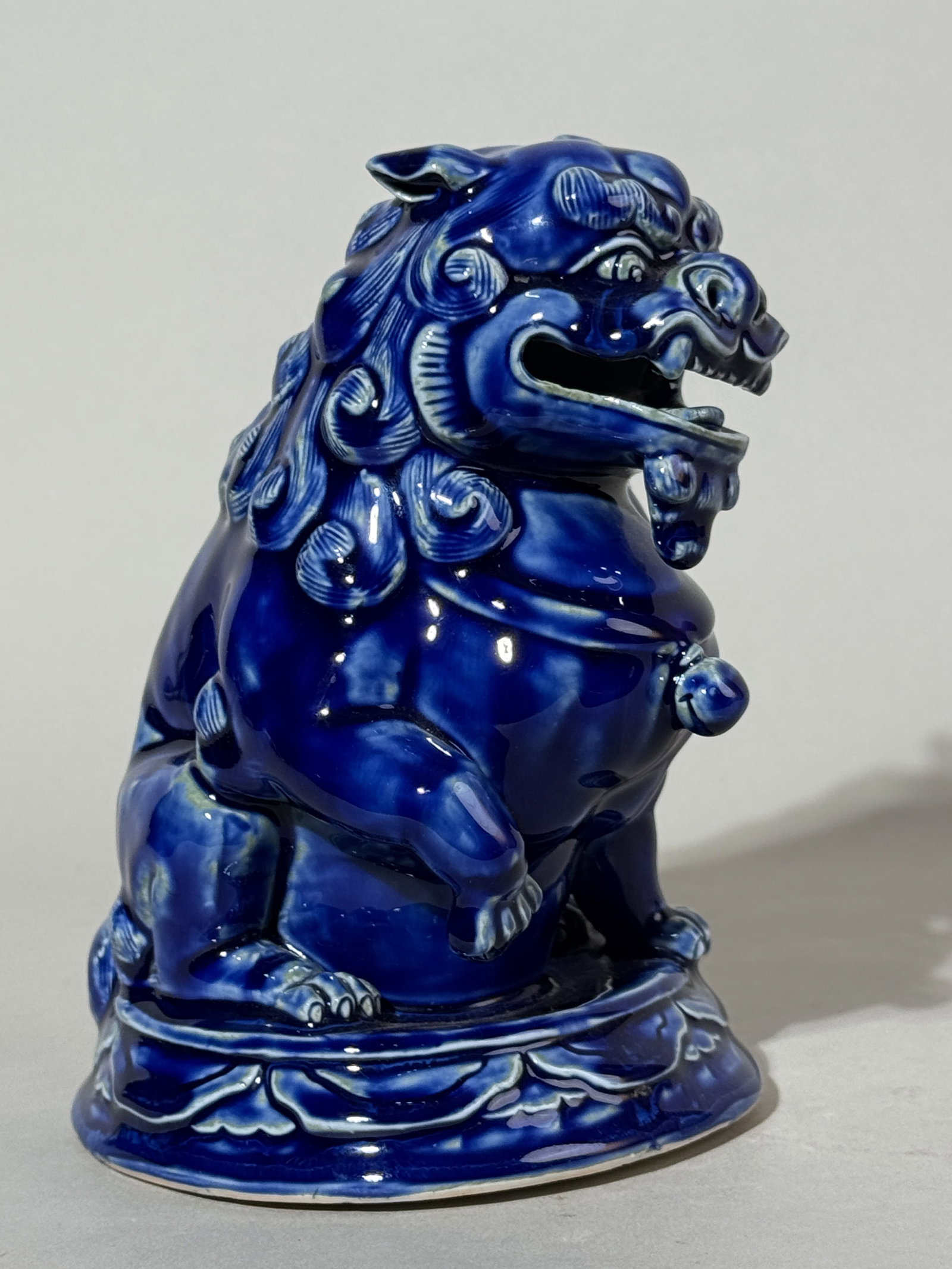 JAPANESE BLUE GLAZED PORCELAIN SHISHI: A Japanese Meiji period porcelain shishi with a blue glaze, signed. Dimensions: Height: 6.75 in. (17.1 cm). Note: This item is in New York, where it can be shipped from.