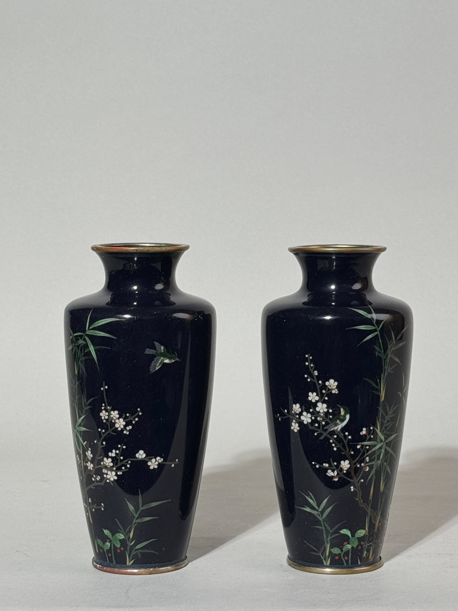 PAIR OF JAPANESE CLOISONNE VASES WITH BIRDS: A pair of Japanese cloisonne vases with birds. Minor scratches on the surface enamel. Dimensions: Height: 6 in. (15.2 cm). Note: This item is in New York, where it can be shipped from.