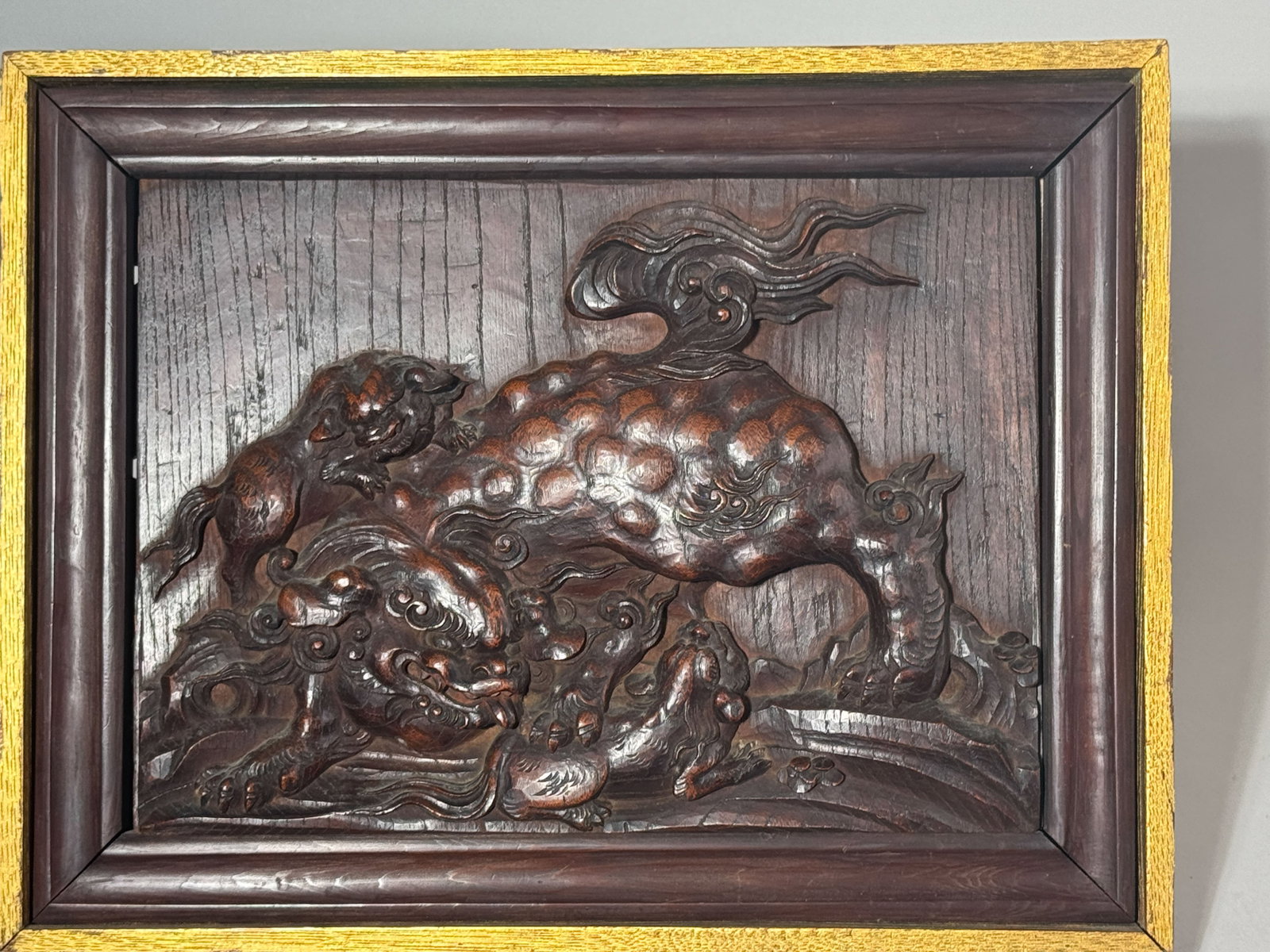 JAPANESE CARVED WOOD SHISHI GROUP PLAQUE: A well-carved Japanese Meiji period wood plaque with a shishi motif. Dimensions: 15.75 x 12 in. (40 x 30.5 cm). Note: This item is in New York, where it can be shipped from.
