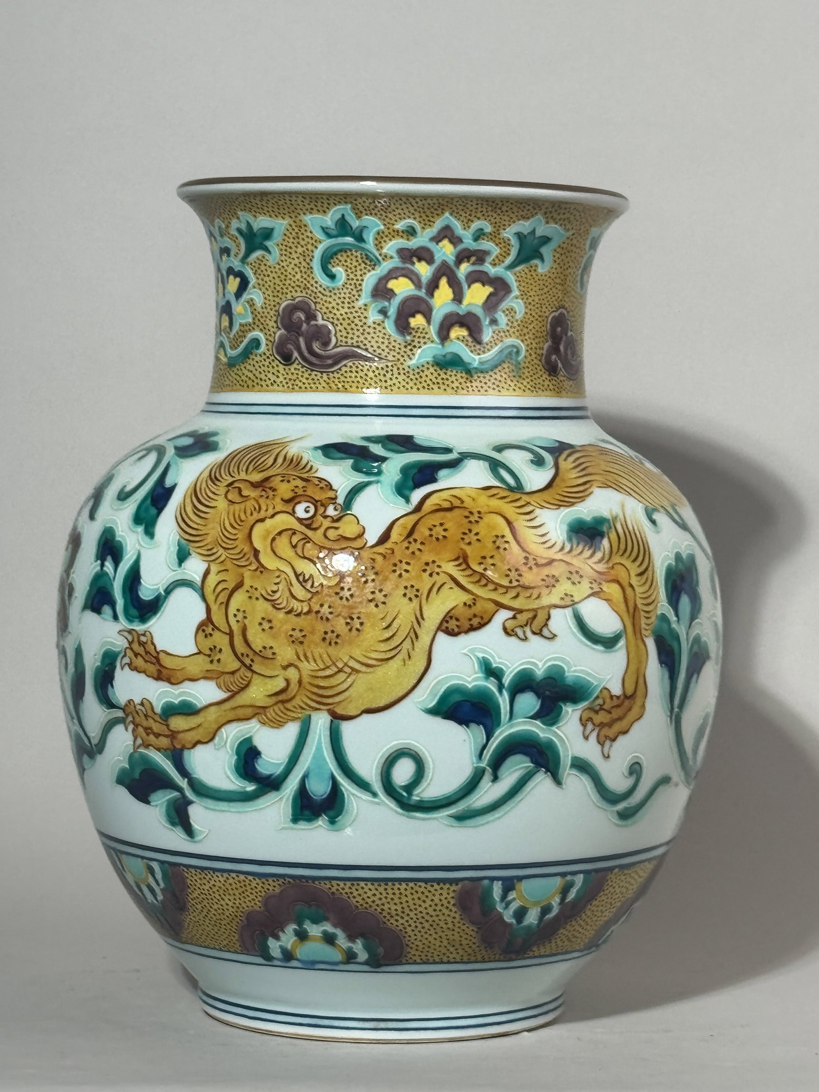 JAPANESE STUDIO PORCELAIN VASE WITH SHISHI MOTIF: A Japanese studio porcelain vase with a shishi motif. Dimensions: Height: 12.75 in. (32.4 cm). Note: This item is in New York, where it can be shipped from.