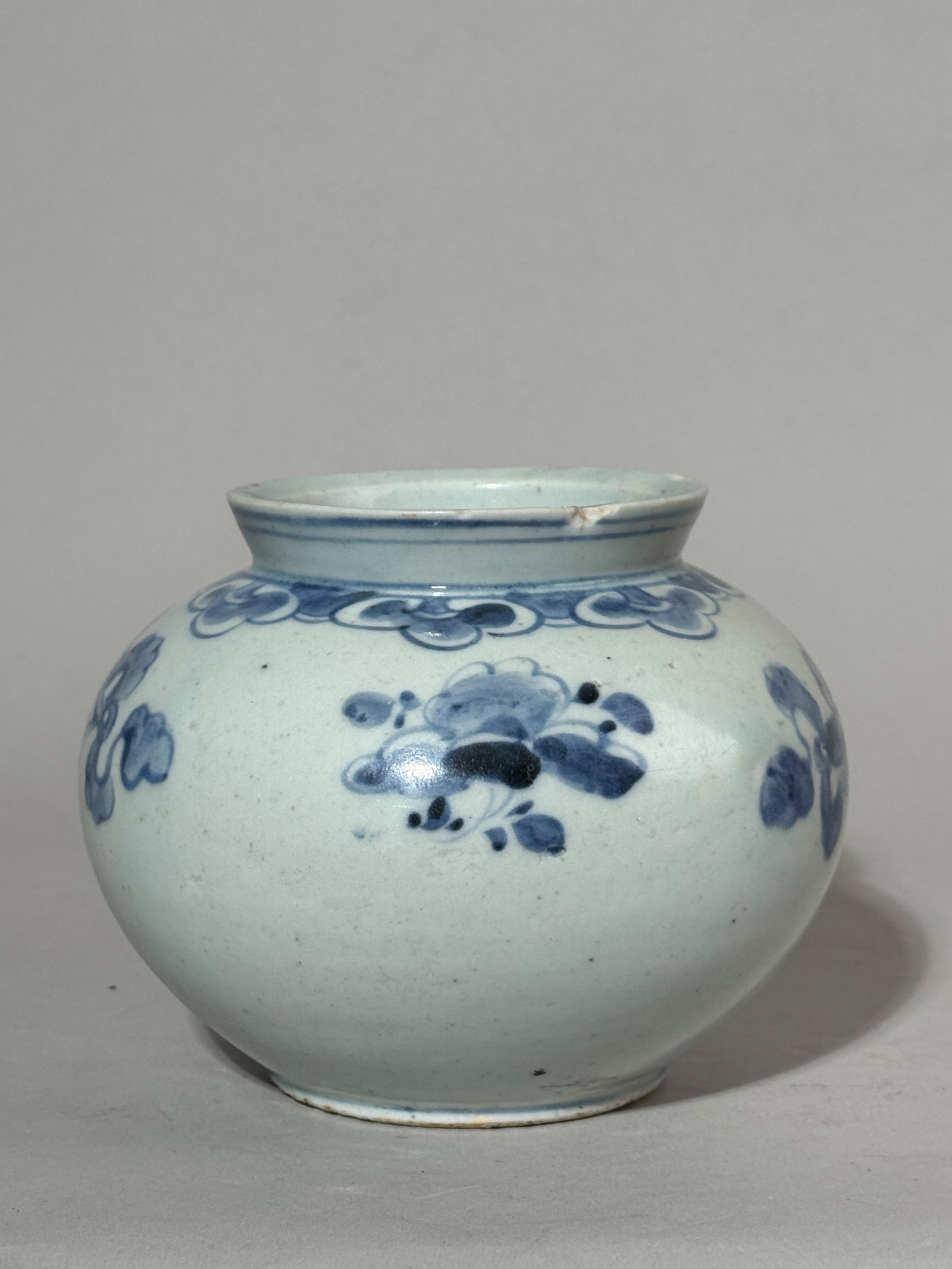 KOREAN BLUE AND WHITE PORCELAIN JAR: An antique Korean blue and white porcelain jar. A few small rim chips. Dimensions: Height: 5 in. (12.7 cm); Width: 6 in. (15.2 cm). Note: This item is in New York, where it can be shipped from.
