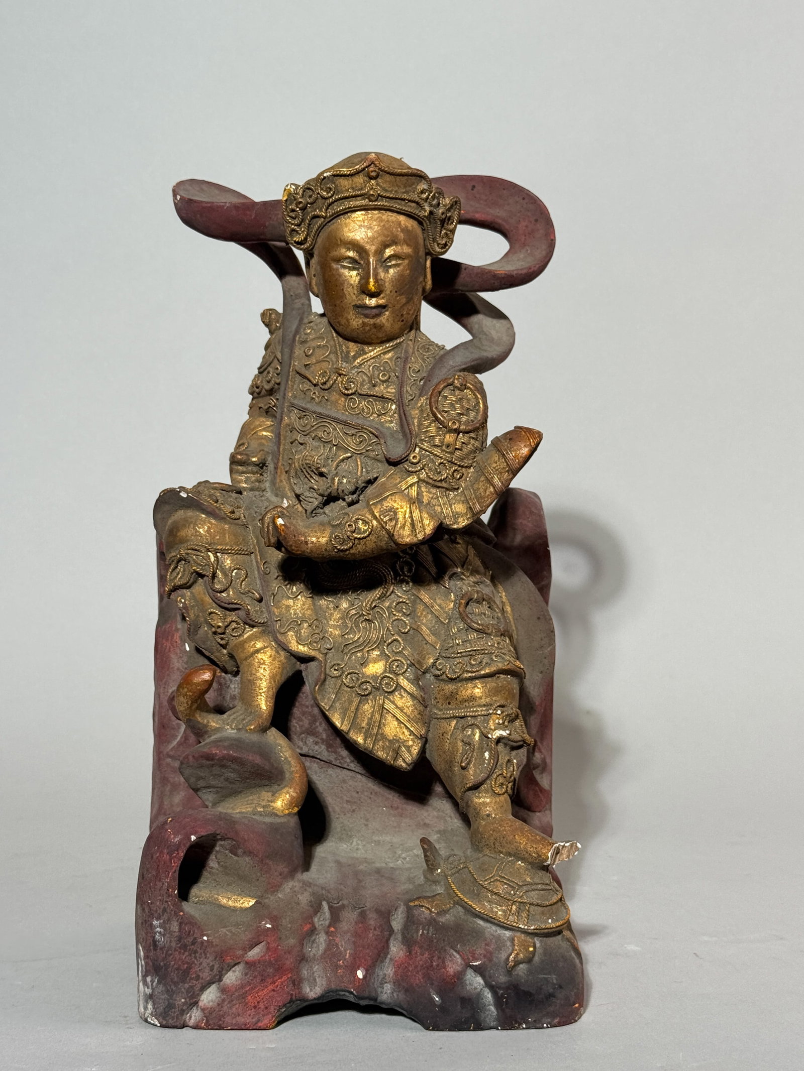 CHINESE CARVED GILT WOOD IMMORTAL: A Chinese carved gilt wood immortal. Chip on the foot. Dimensions: Height: 11 in. (27.9 cm). Note: This item is in New York, where it can be shipped from.