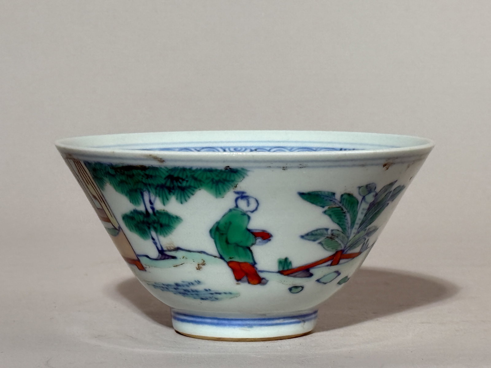 CHINESE DOUCAI PORCELAIN BOWL WITH FIGURAL SCENE: A Chinese Doucai porcelain bowl with a figural scene. Dimensions: Diameter: 5 in. (12.7 cm); Height: 2.5 in. (6.4 cm). Note: This item is in New York, where it can be shipped from.