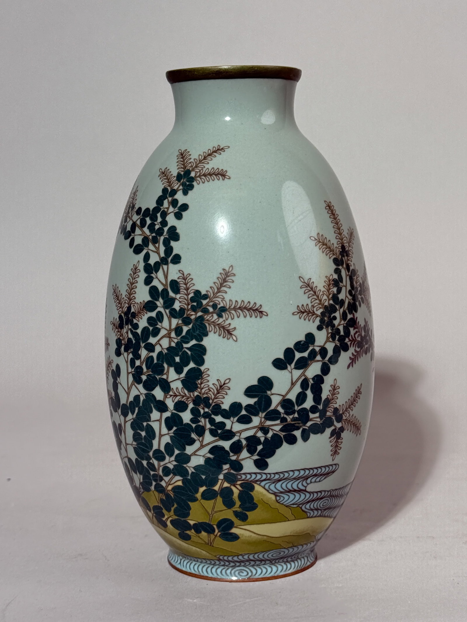 JAPANESE CLOISONNE VASE WITH FLORAL MOTIF: A Japanese Meiji period cloisonne vase with a floral motif. Dimensions: Height: 7.25 in. (18.4 cm). Note: This item is in New York, where it can be shipped from.