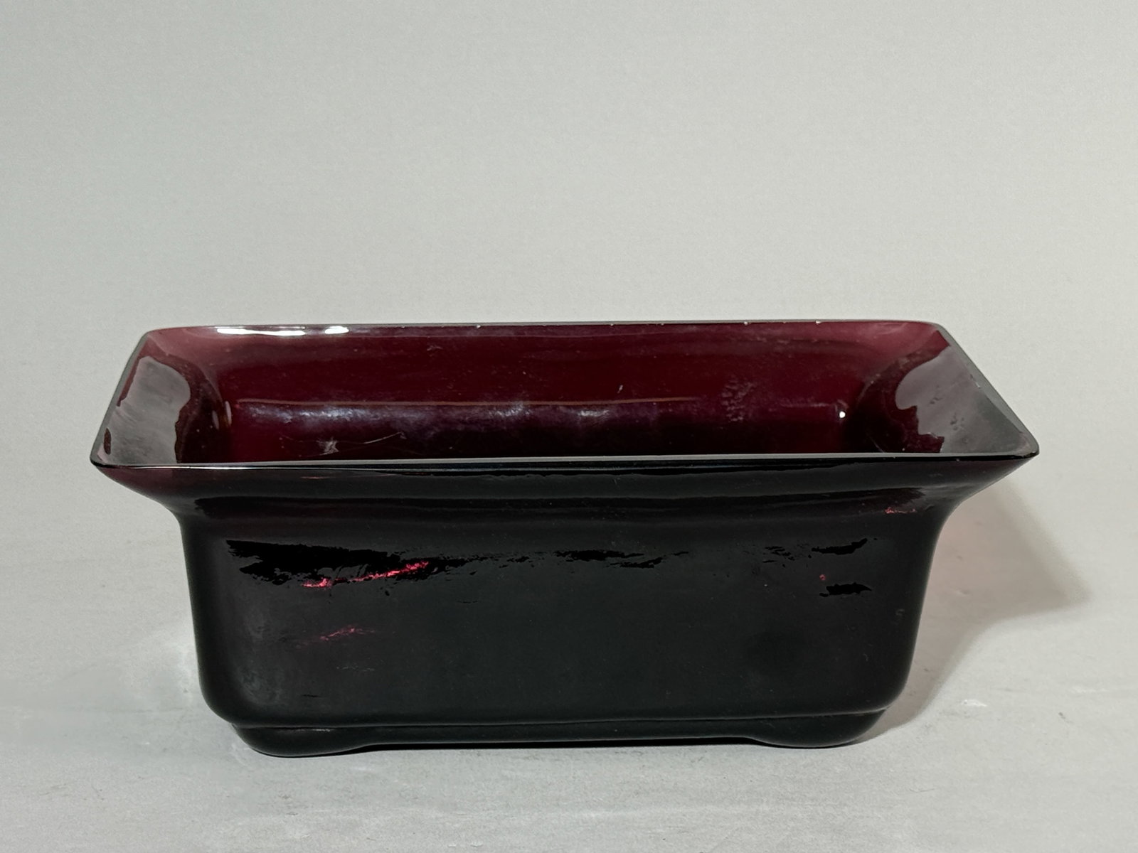 CHINESE PURPLE PEKING GLASS PLANTER: A Chinese purple Peking glass planter. Dimensions: 5.5 x 8.5 in. (14 x 21.6 cm); Height: 3.5 in. (8.9 cm). Note: This item is in New York, where it can be shipped from.