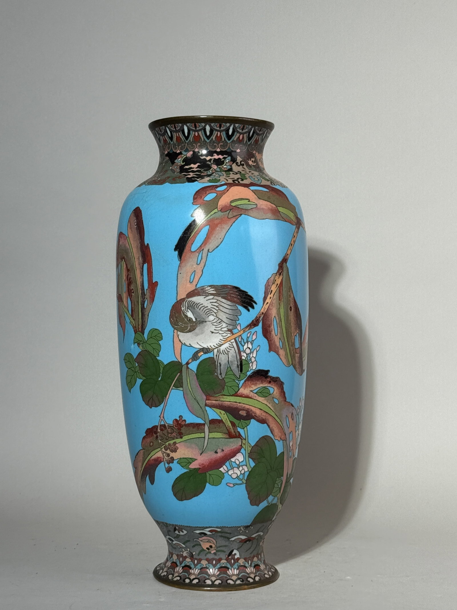 JAPANESE CLOISONNE VASE WITH BIRD SCENE: A large Japanese cloisonne vase with a bird scene. Enamel losses and hairline. Dimensions: Height: 16.25 in. (41.3 cm). Note: This item is in New York, where it can be shipped from.