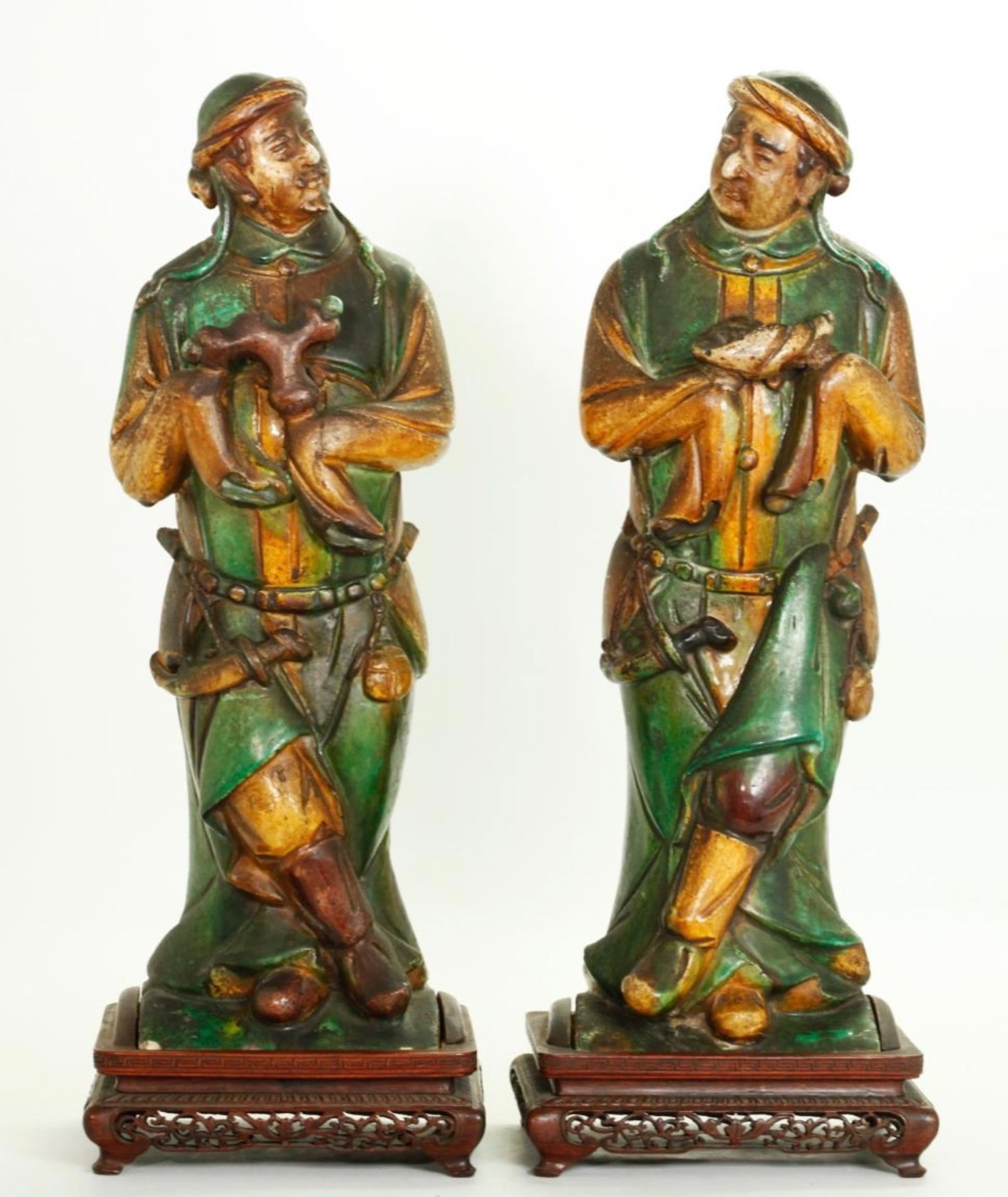 PAIR OF CHINESE MING SANCAI FIGURINES: A pair of Chinese Ming dynasty Sancai pottery figurines. Losses of ceramic. Dimensions: Height: 16 in. (40.6 cm). Note: This item is in New York, where it can be shipped from.