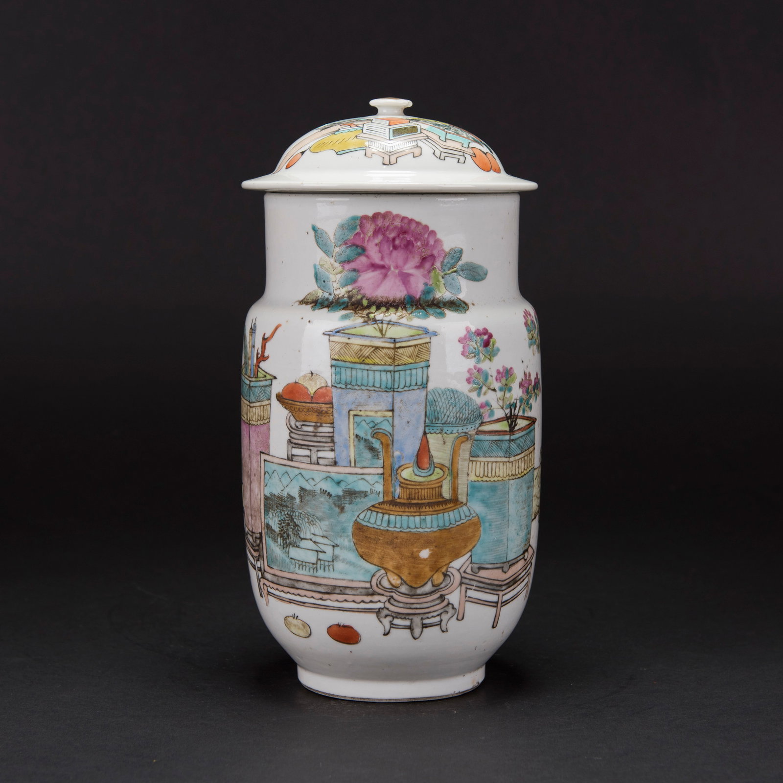A FAMILLE ROSE "ANTIQUE AND PRECIOUS OBJECTS" JAR AND COVER: A famille rose "antique and precious objects" jar and cover, painted with antique vases and flowers. 11.02"h x 5.12"w (28 x 13 cm)