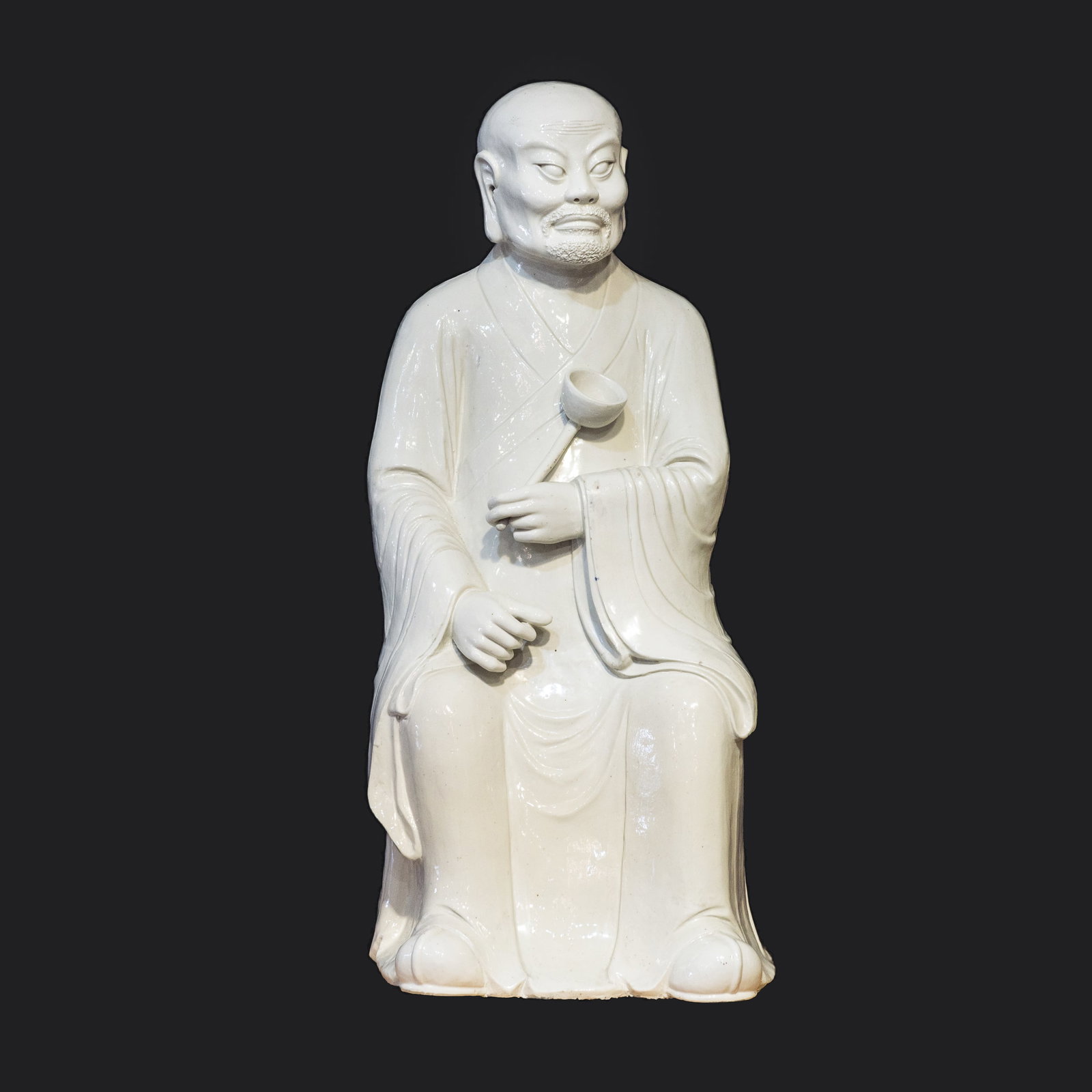 A WHITE GLAZED PORCELAIN FIGURE OF LUOHAN, QIANLONG PERIOD (1 of 5)