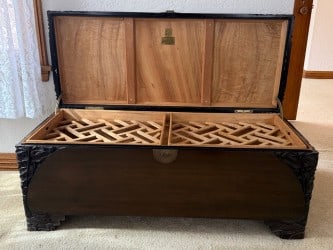 A CHINESE CARVED WOOD CHEST: A Chinese carved wood chest. H20" x W20" x L48" Provenance: Private collection of the Smith family, Santa Monica, California, by descent.