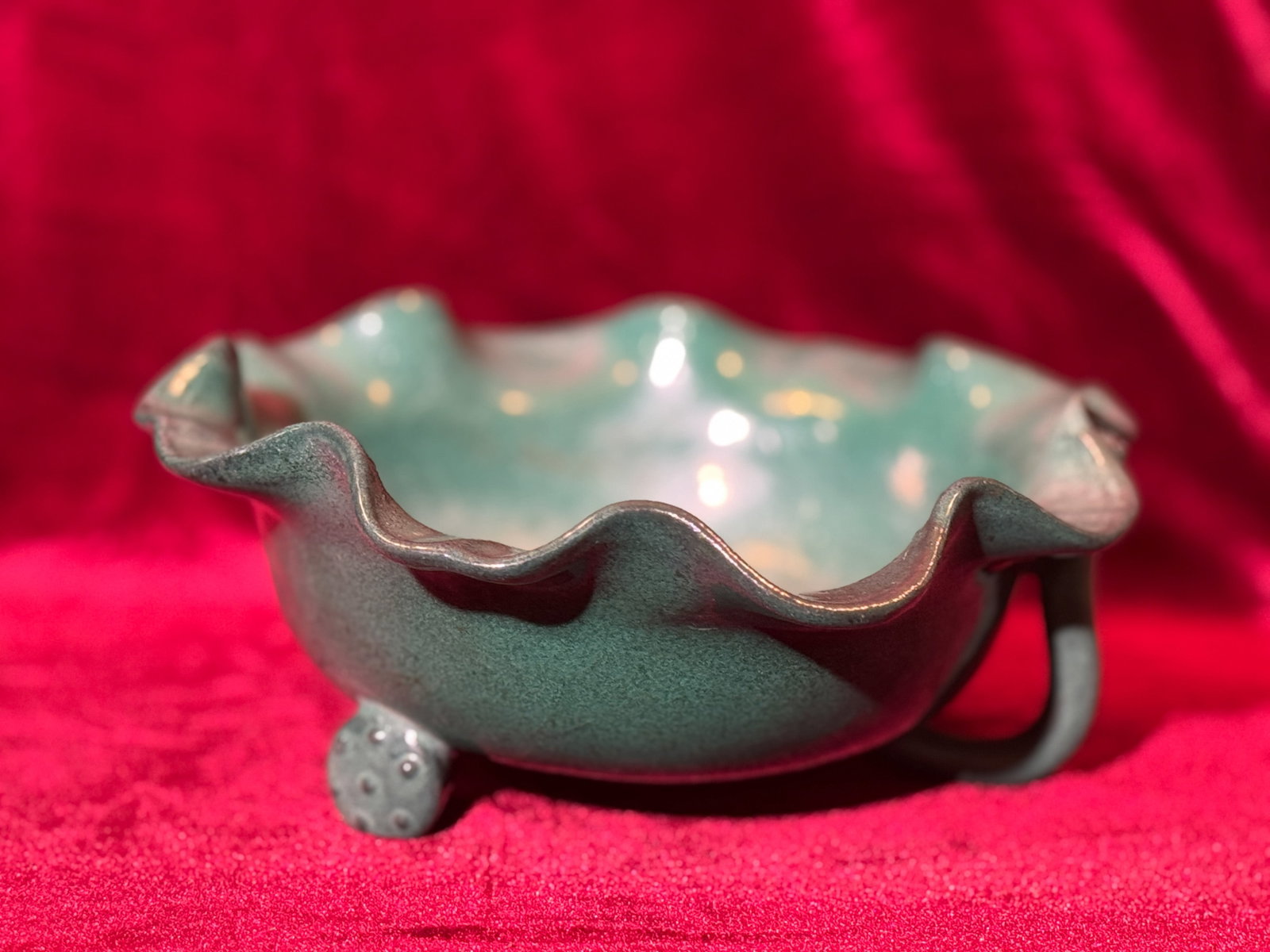 CHINESE YIXING CLAY LOTUS BOWL WITH GREEN GLAZE: Chinese Yixing lotus bowl with green glaze. Dimensions: Diameter: 8.75 in. (22.2 cm); Height: 3.5 in. (8.9 cm). Note: This item is in New York, where it can be shipped from.
