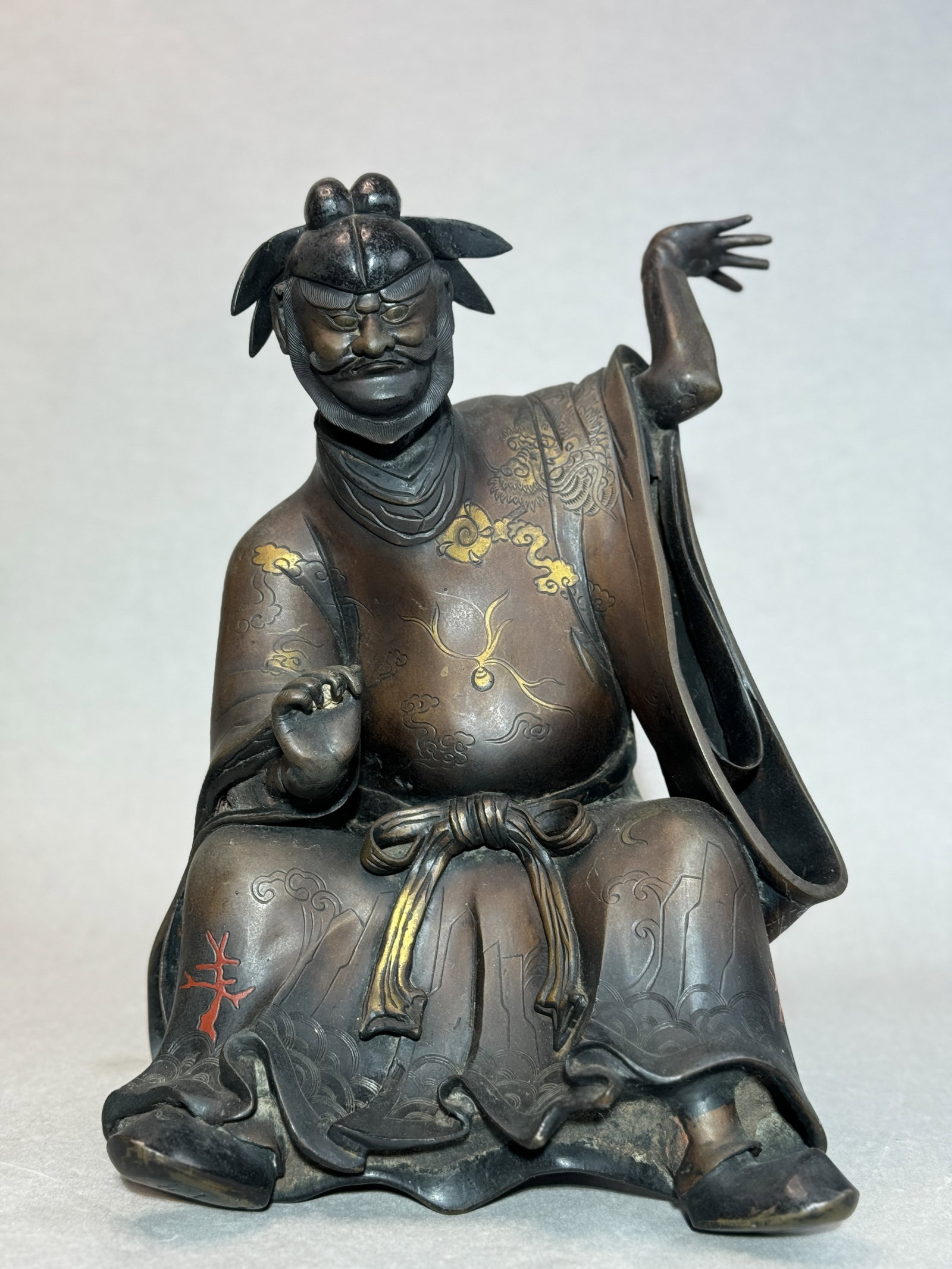 JAPANESE MEIJI BRONZE FIGURINE OF SHOKI: 19th century. Japanese Meiji bronze figurine of Shoki, very heavy in weight, with gilt highlights. Dimensions: Height: 13.5 in. (34.3 cm); Width: 9.5 in. (24.1 cm). Note: This item is in New York,