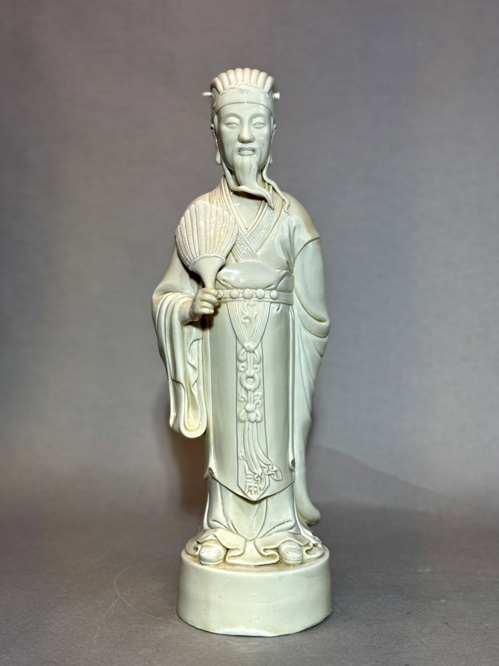 CHINESE DEHUA PORCELAIN FIGURINE: 19th/20th century. Chinese Dehua porcelain figurine, signed with an impressed seal. Dimensions: Height: 17.5 in. (44.5 cm). Note: This item is in New York, where it can be shipped from.