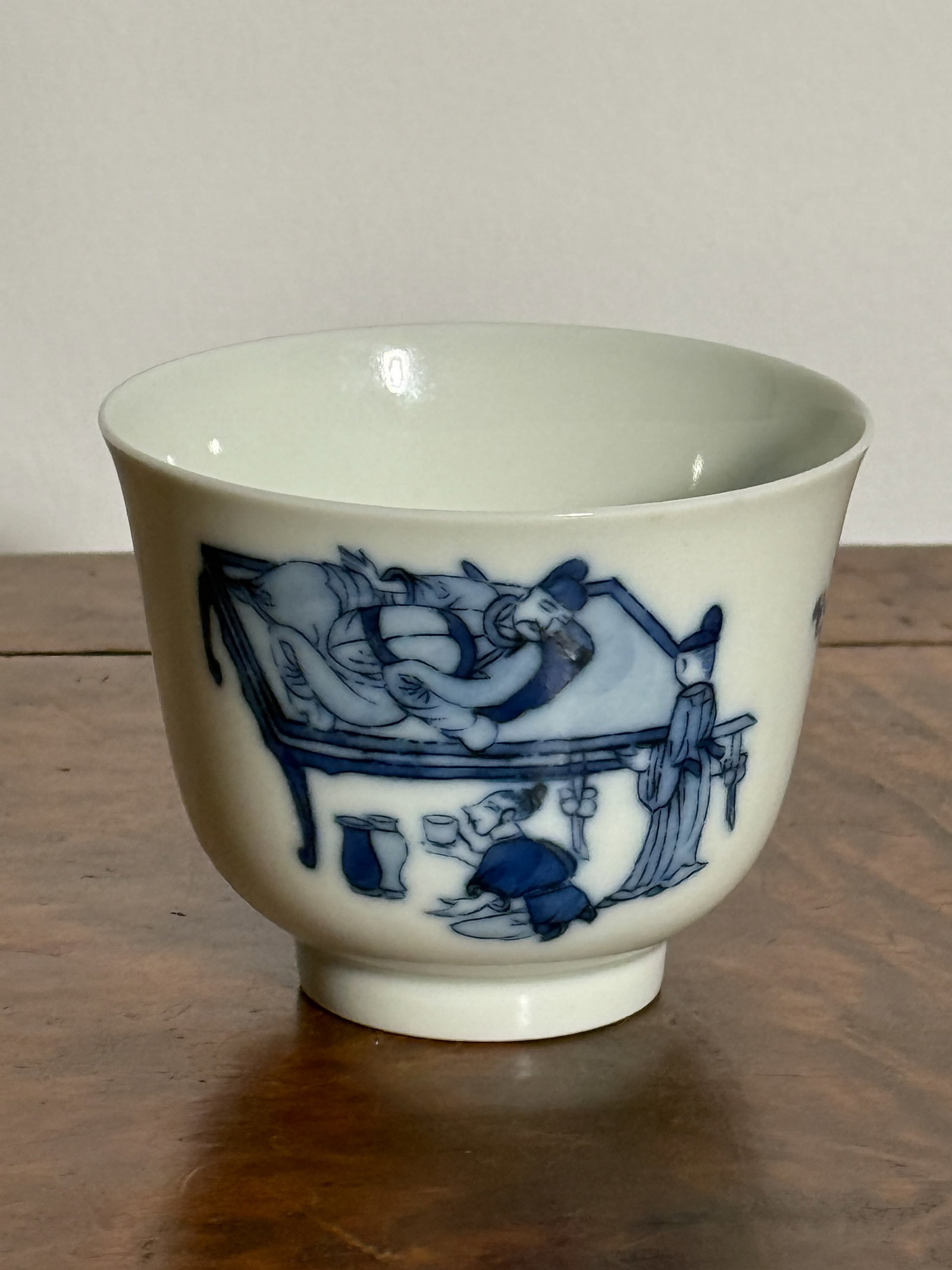 CHINESE BLUE AND WHITE PORCELAIN CUP WITH FIGURAL SCENE: Chinese blue and white porcelain cup with drunken poet. Dimensions: Diameter: 3.25 in. (8.3 cm); Height: 3.5 in. (8.9 cm). Note: This item is in New York, where it can be shipped from.