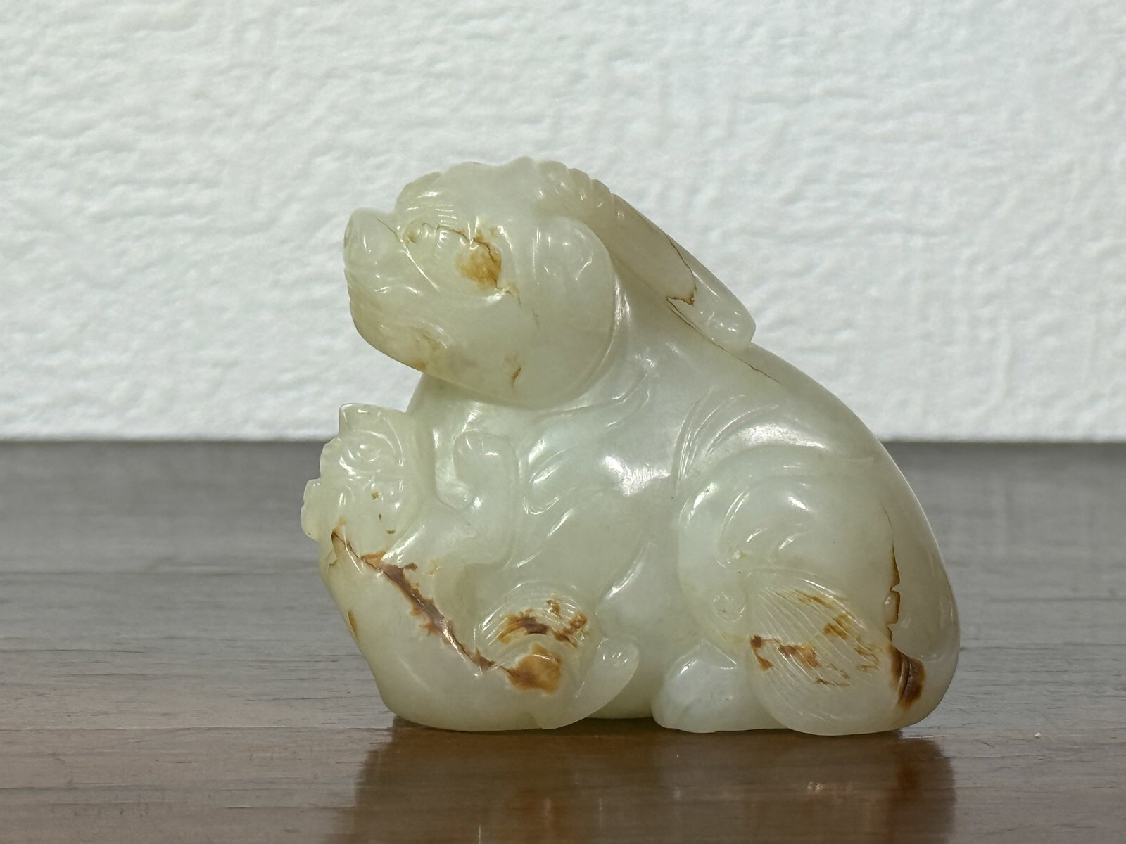 CHINESE WHITE JADE BEAST GROUP: Chinese white jade beast group. Dimensions: Height: 2.2 in. (5.6 cm); Length: 2.5 in. (6.3 cm). Note: This item is in New York, where it can be shipped from.
