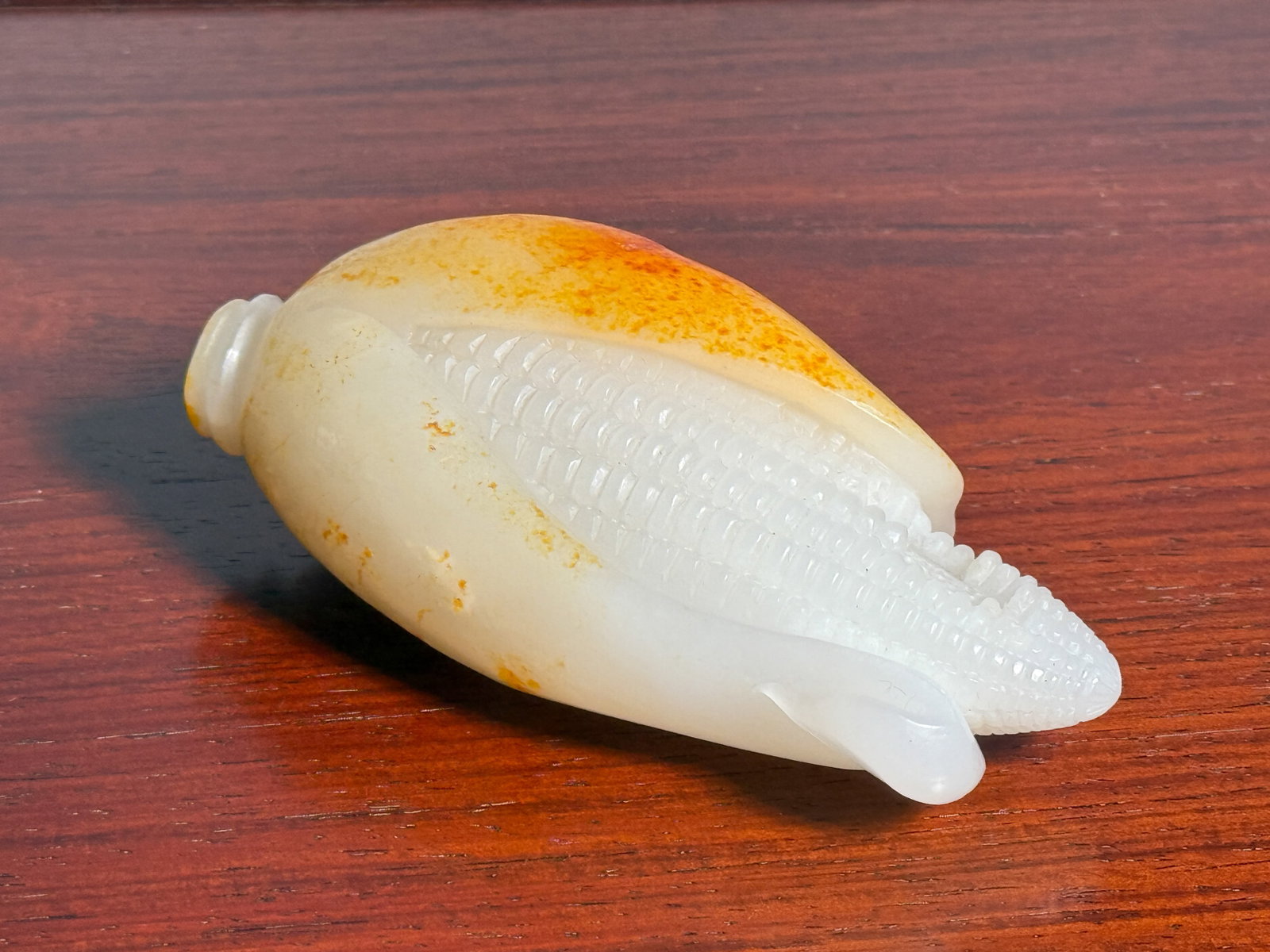 CHINESE WHITE JADE CORN CARVING: Chinese white jade carving of a peeling corn with golden-yellow skin. Dimensions: Length: 4.75 in. (12.1 cm). Note: This item is in New York, where it can be shipped from.