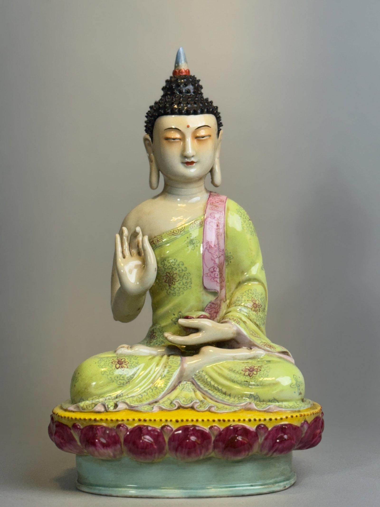 CHINESE FAMILLE ROSE PORCELAIN SEATED BUDDHA: Chinese famille rose porcelain seated Buddha. Dimensions: Height: 6 in. (15.2 cm). Note: This item is in New York, where it can be shipped from.