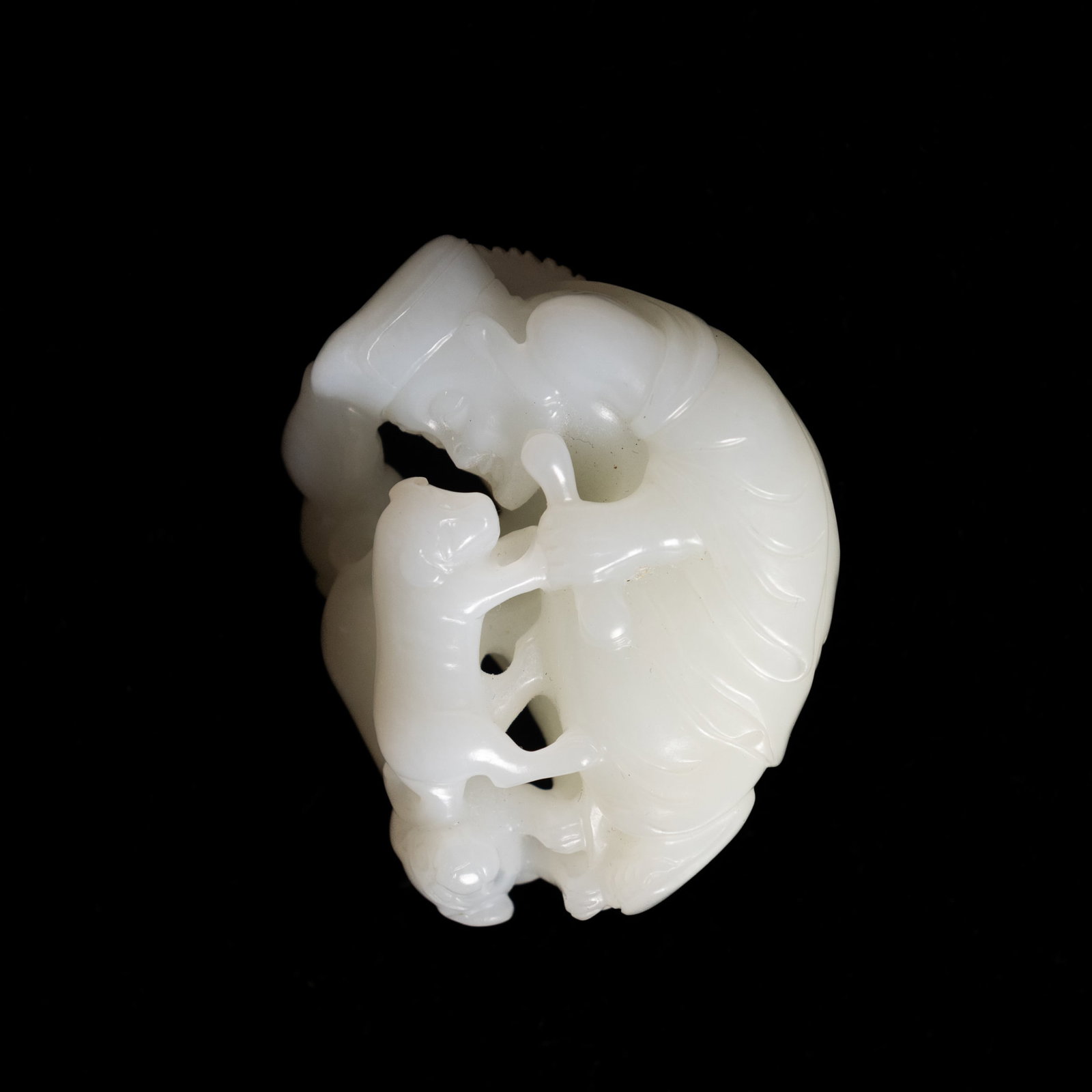 A CHINESE WHITE JADE CARVING OF JIGONG: A Chinese white jade carving of Jigong. 2.17"h x 1.77"w x 0.98"l (5.5 x 4.5 x 2.5 cm) Provenance: Property from a San Francisco private collection.