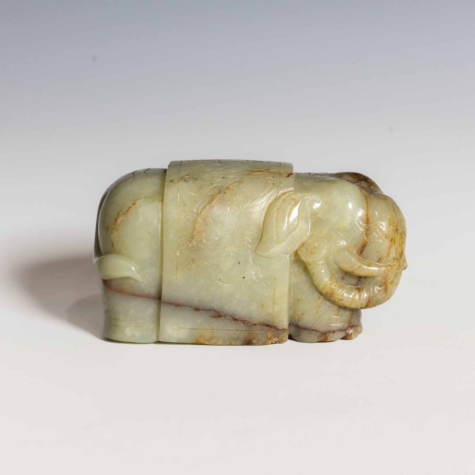 CHINESE WHITE JADE CARVING: Chinese white jade carving of a scholar with a deer and a monkey, carved in high relief, depicting the scholar standing beside a deer and a playful monkey clambering up a tree branch. The stone is of 