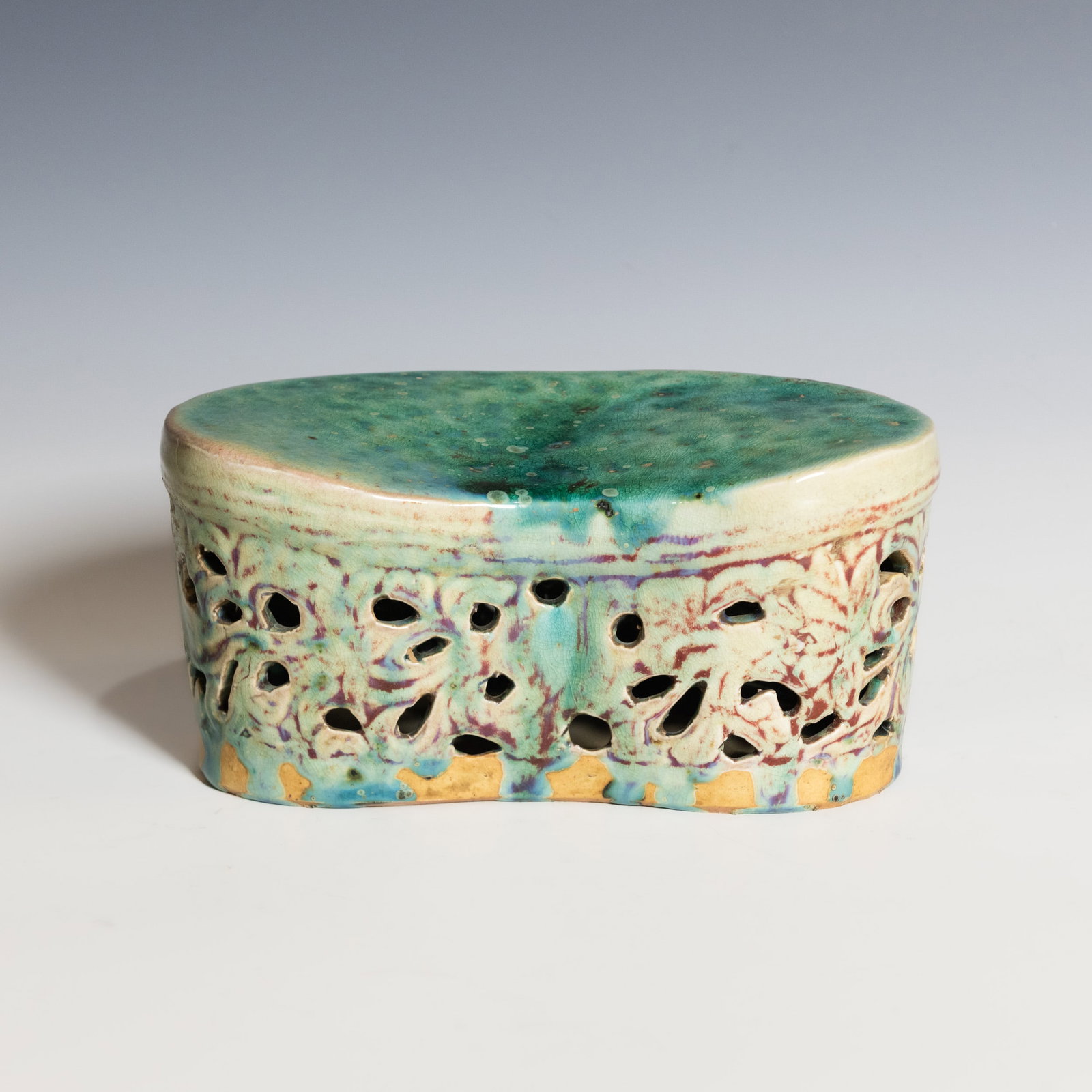 A CHINESE FAHUA-STYLE TURQUOISE-GLAZED RETICULATED PILLOW (1 of 8)