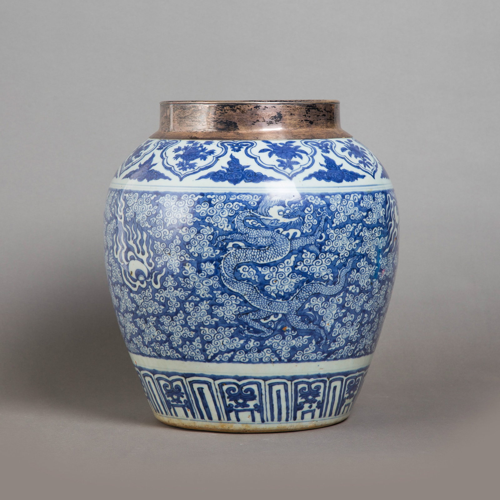 BLUE-AND-WHITE 'DRAGON' JAR, MING DYNASTY, WANLI PERIOD: Blue-and-white 'dragon' jar, Ming dynasty, Wanli period. The ovoid body is painted with two five-clawed dragons striding amidst stylized flames and scrolls and separated by two pearls, above a band of