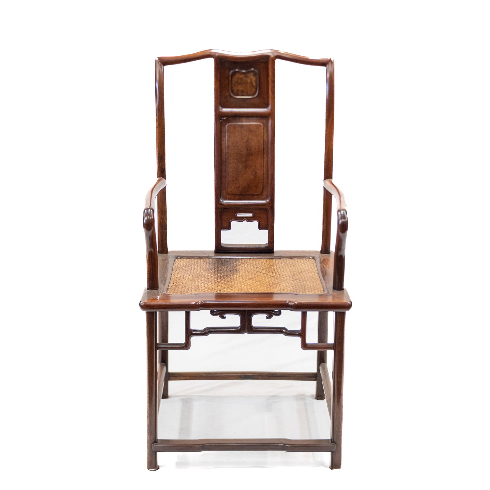HARDWOOD OR ZITAN SOUTHERN OFFICIAL'S HAT ARMCHAIR, 18TH CENTURY: Chinese hardwood or zitan southern official's hat armchair, nanguanmaoyi, with a stepped crest rail above a curved splat and mat seat. 42.13"h x 20.47"w x 16.54"d (107 x 52 x 42 cm)