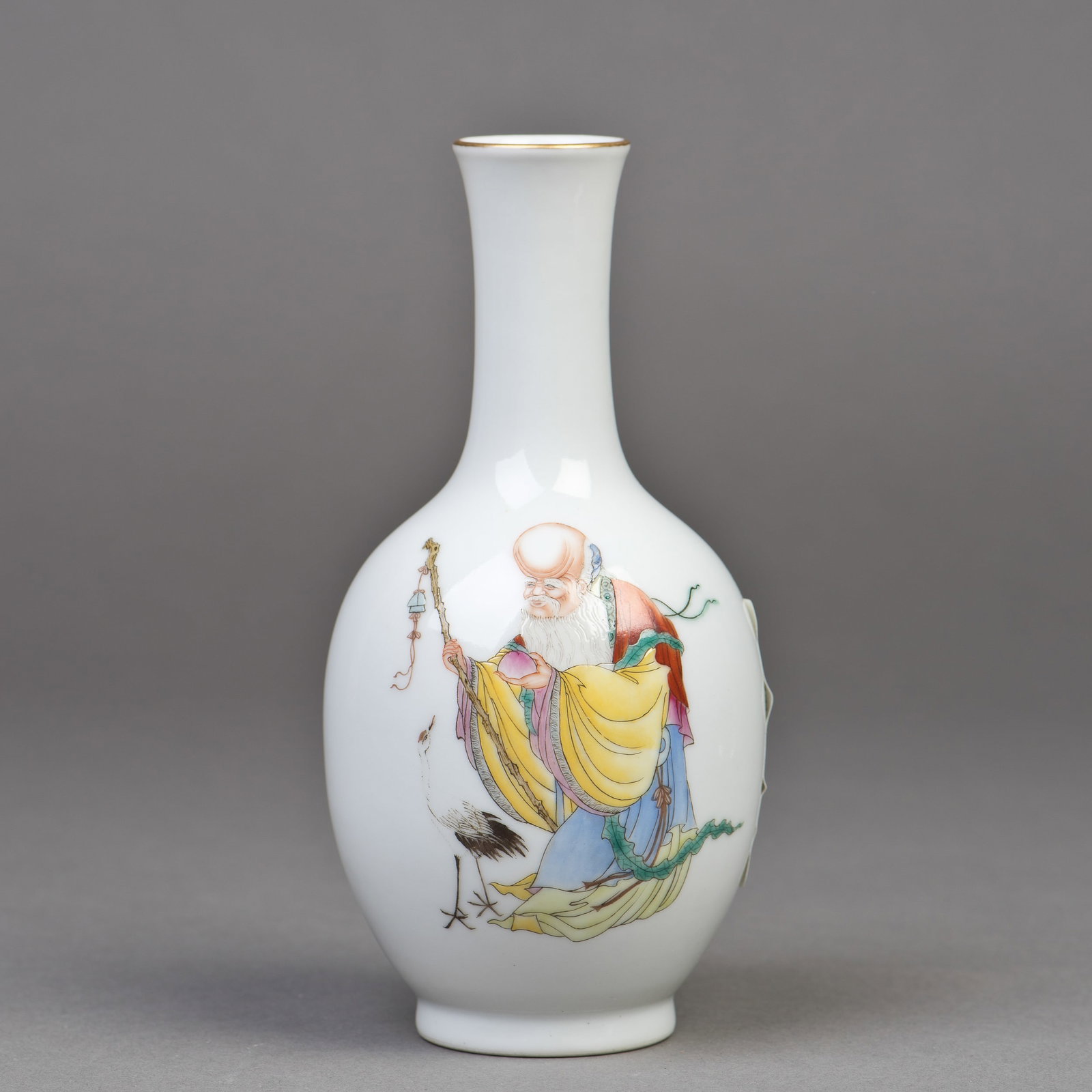 CHINESE FAMILLE-ROSE PORCELAIN VASE, EARLY 20TH CENTURY: Chinese famille-rose porcelain vase, early 20th century. Decorated with a longevity Buddha holding a longevity peach in one hand and a scepter in the other, and a female deity carrying a basket of
