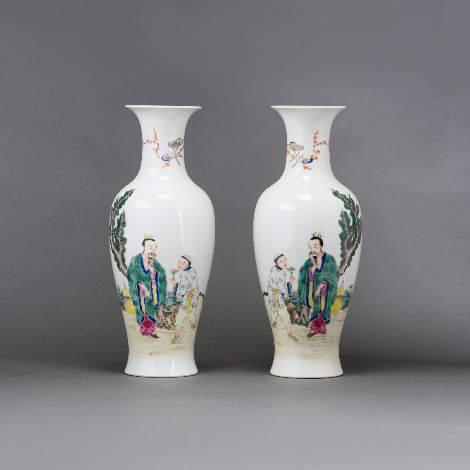 (LOT OF 2) PAIR OF FAMILLE-ROSE 'FIGURAL' VASES, QIANLONG MARK: (lot of 2) Pair of famille-rose 'figural' vases, each of baluster form and decorated in mirror image with figures. Each bears a six-character Qianlong seal mark on the base. 13.39"h x 5.12"w (34 x 13