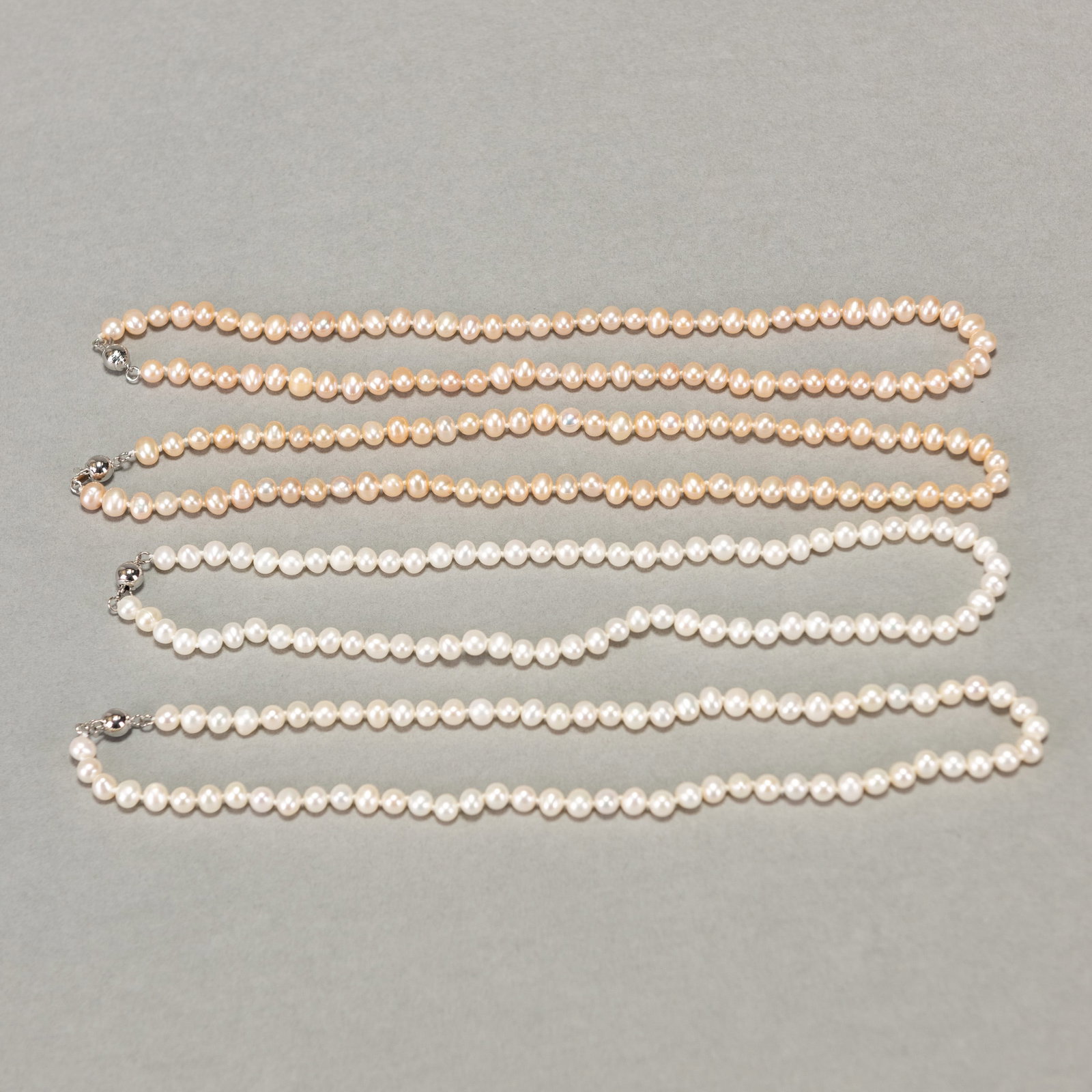 (LOT OF 4) FOUR STRANDS OF WHITE, PINK AND PEACH PEARL NECKLACES (1 of 3)