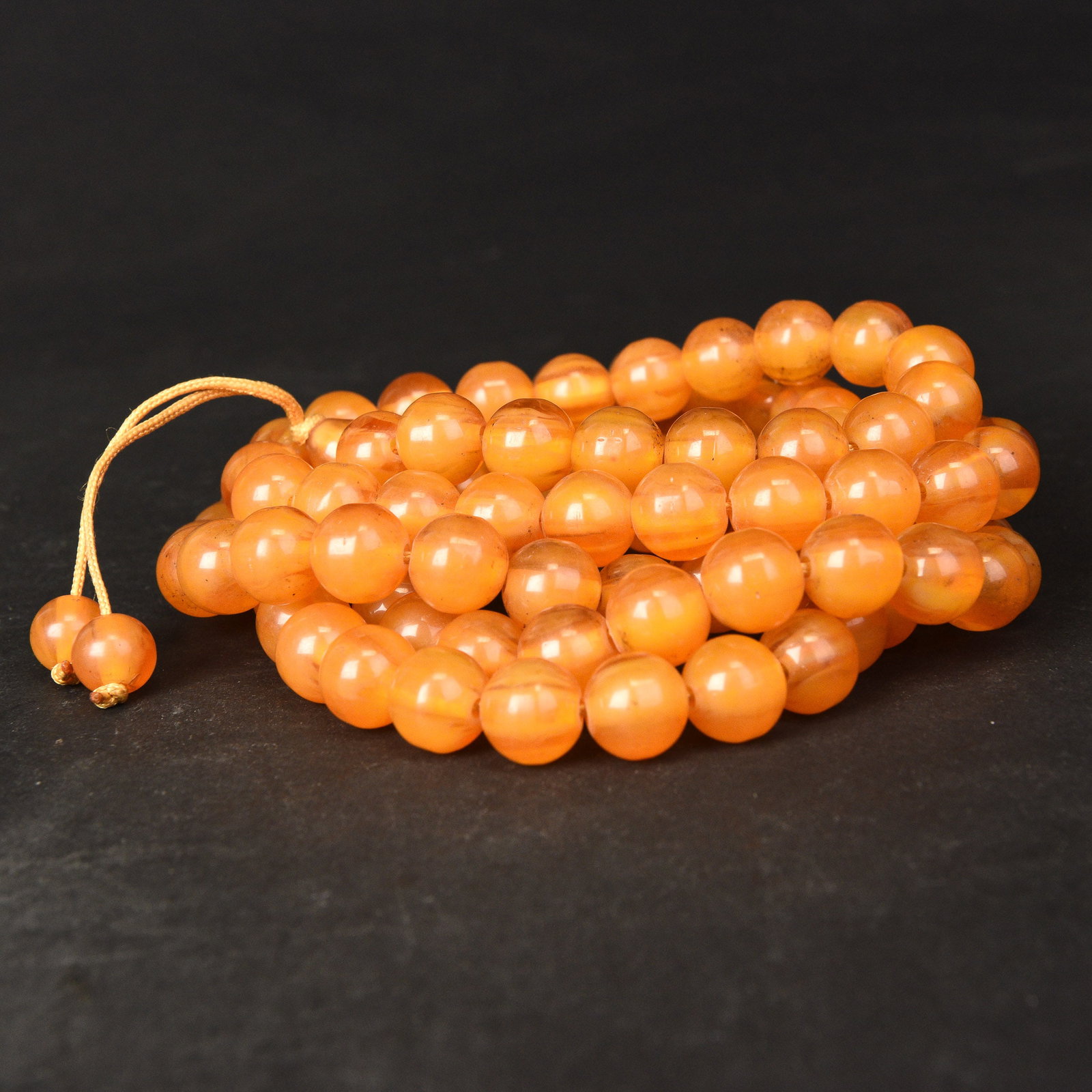 A STRING OF AMBER BEADS (1 of 2)