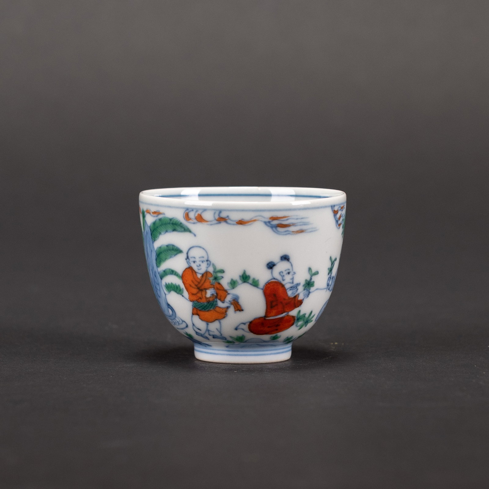A DOUCAI 'FIGURAL' CUP, CHENGHUA MARK: A doucai 'figural' cup, Chenghua mark. H4.5 x 6 cm