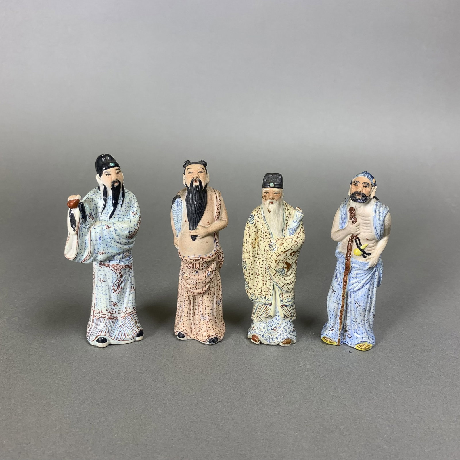 (LOT OF 4) A GROUP OF FOUR FAMILLE-ROSE PORCELAIN FIGURES (1 of 5)