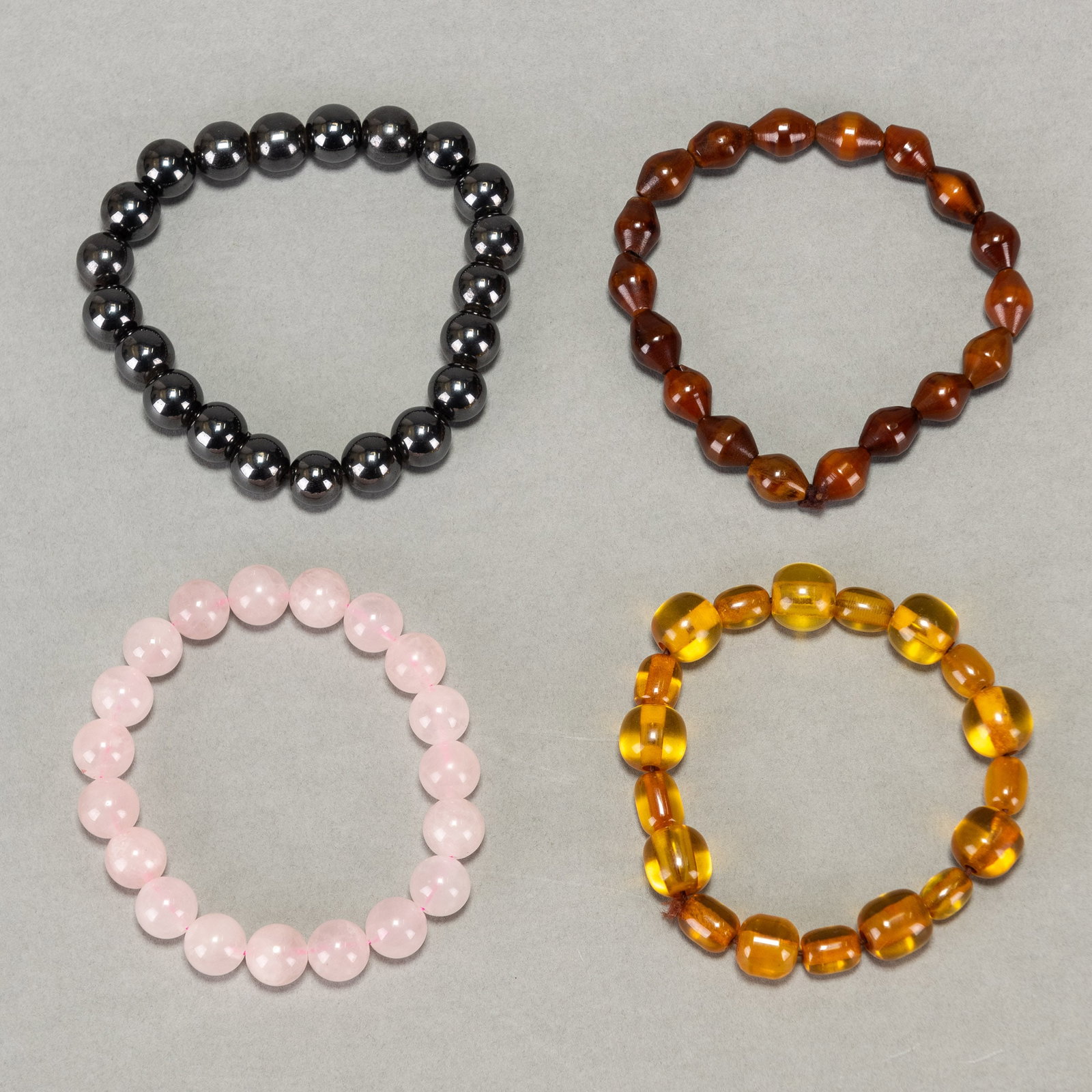 (LOT OF 4) AGATE, ROSE QUARTZ AND BEESWAX RESIN BEAD BRACELETS: (lot of 4) Agate, rose quartz and beeswax resin bead bracelets. Approx. length: 7.87" (20 cm); 76.9 gross dwt