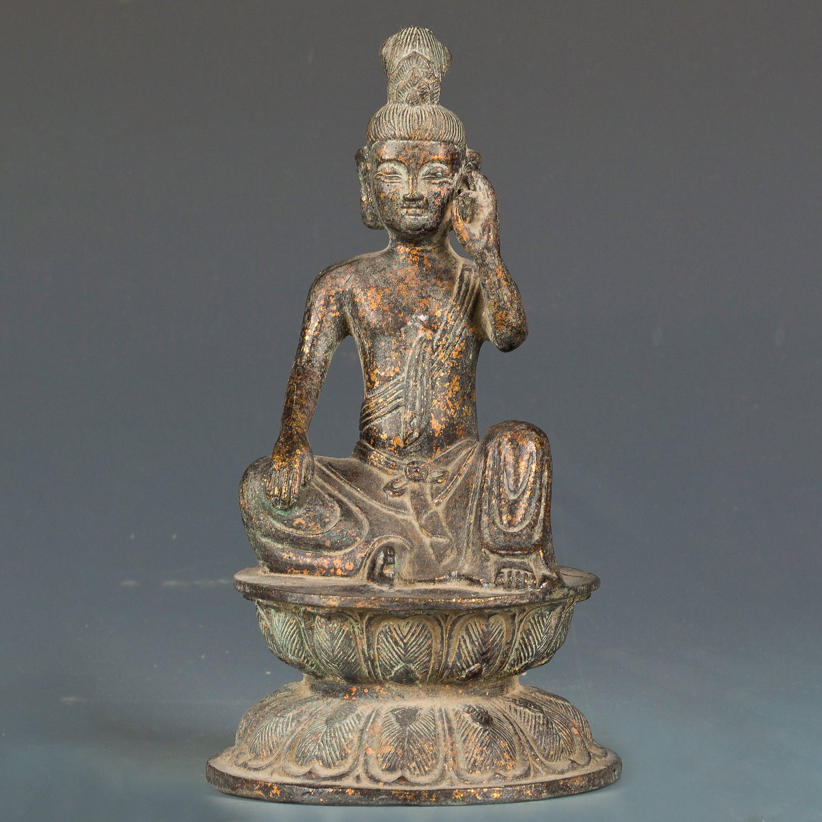 BRONZE BUDDHA: Dark-colored bronze Buddha with vivid details, seated on a lotus base. 8.5"h x 4.75"d