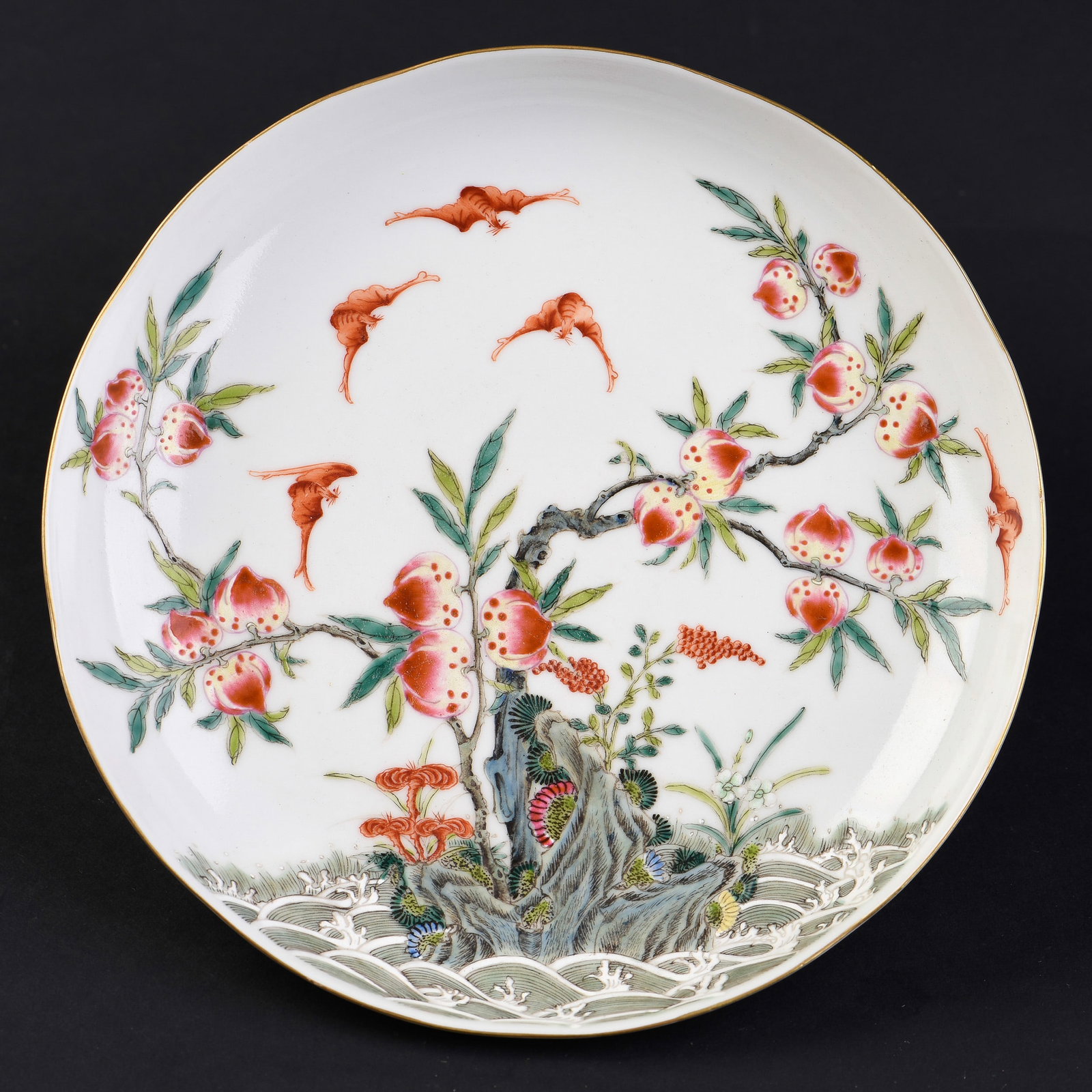 CHINESE FAMILLE-ROSE PORCELAIN DISH, 19TH CENTURY: Chinese famille-rose porcelain dish, 19th century. The decoration depicts a classical Chinese peach-and-bat motif. Signed and with seals on the base. 1.75"h x 7.5"w (4.45 x 19.05 cm) Provenance:
