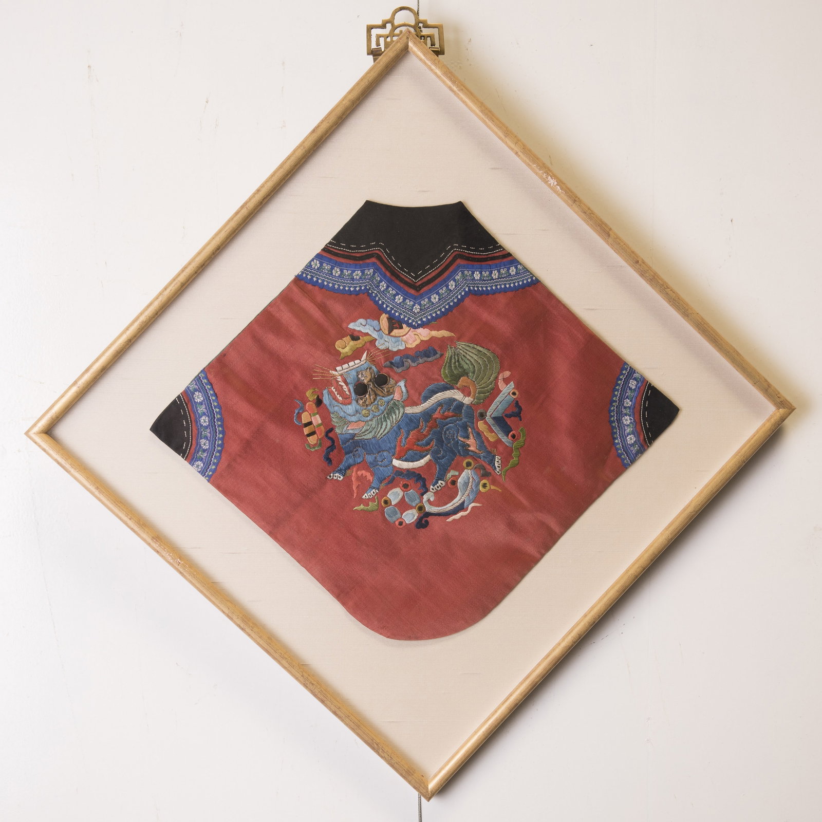 A CHINESE EMBROIDERED DRAGON: A Chinese embroidered dragon, mounted and framed. 13.78"h x 13.78"w (35 x 35 cm) Provenance: Estate sale from Reno, NV.