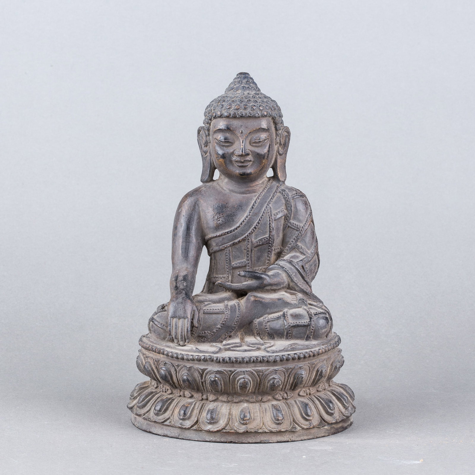 A BRONZE SCULPTURE OF BUDDHA: A bronze sculpture of Buddha. H20 x 13 cm