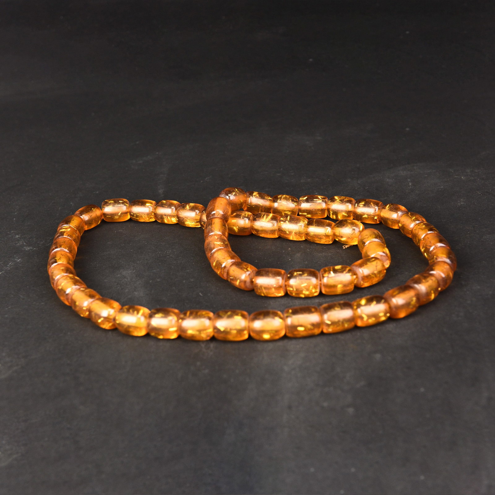 A STRING OF AMBER BEADS (1 of 2)