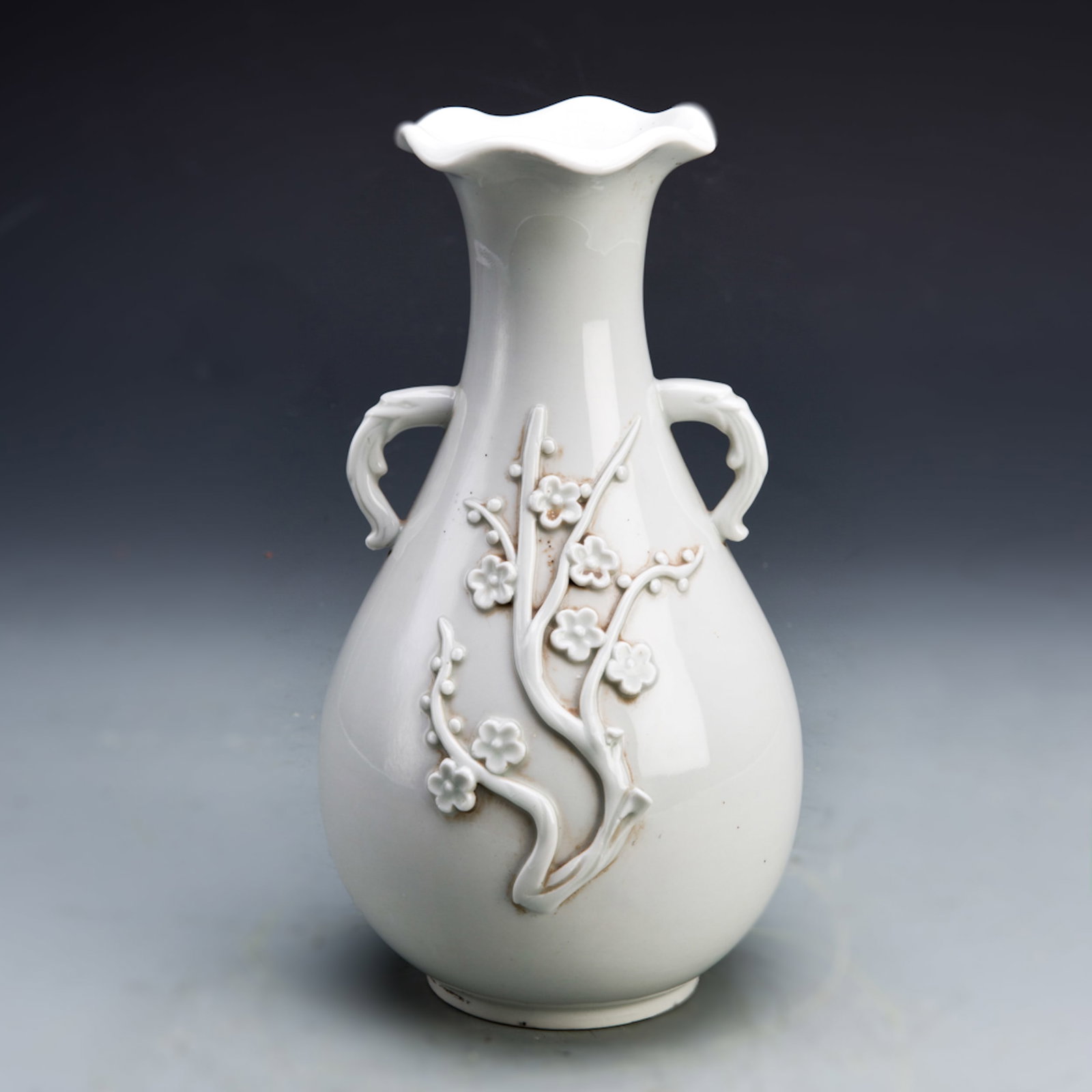 A BLANC-DE-CHINE VASE WITH PLUM BLOSSOM RELIEF (1 of 2)