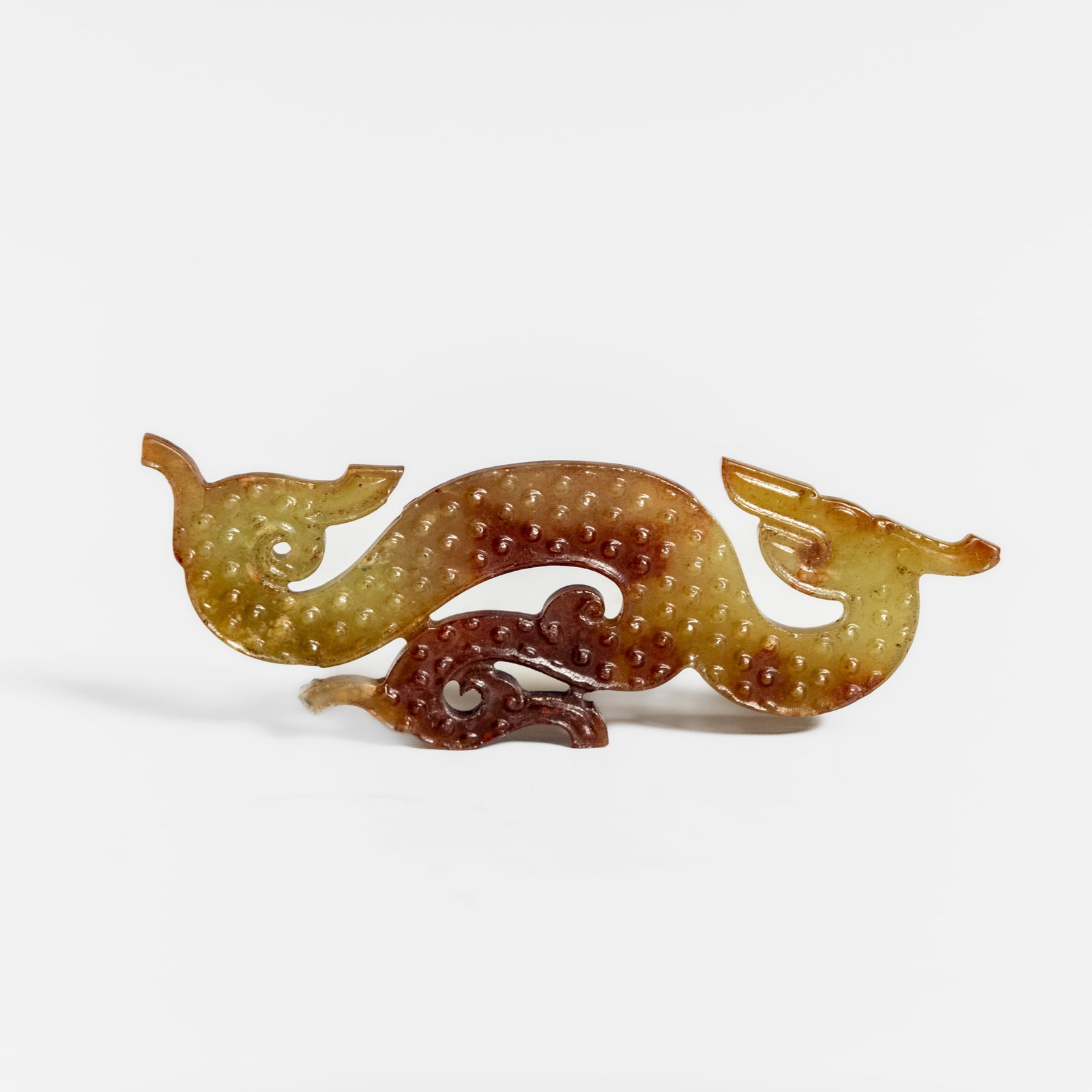 CHINESE CARVED RUSSET JADE PLAQUE: Chinese carved russet jade plaque. 4.33"h x 1.57"w x 0.16"l (11 x 4 x 0.4 cm)