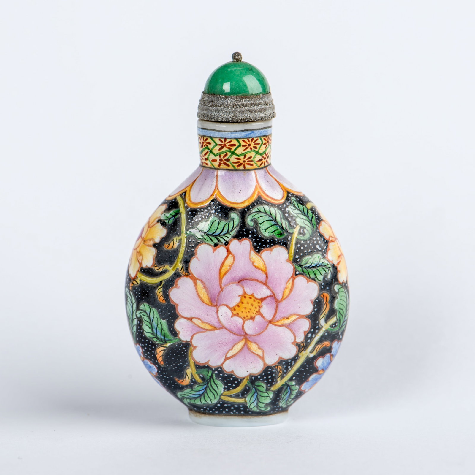 A FAMILLE-ROSE 'FLOWER' SNUFF BOTTLE: A famille-rose 'flower' porcelain snuff bottle. 2.76"h x 1.57"w (7 x 4 cm)