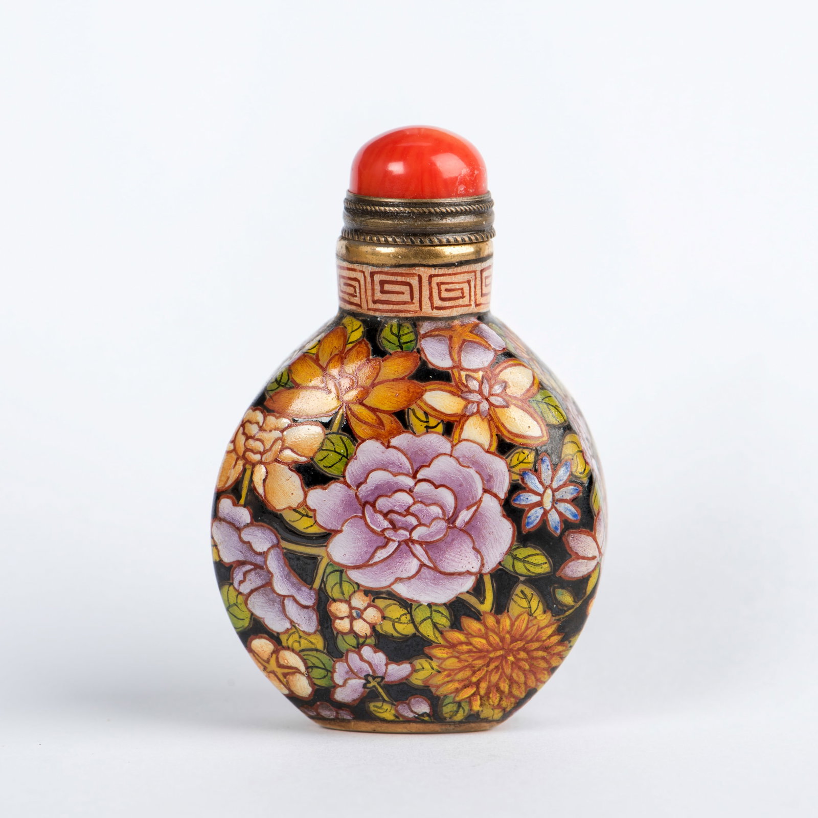A FAMILLE-ROSE 'FLOWER' SNUFF BOTTLE: A famille-rose 'flower' porcelain snuff bottle. 2.56"h x 1.57"w (6.5 x 4 cm)