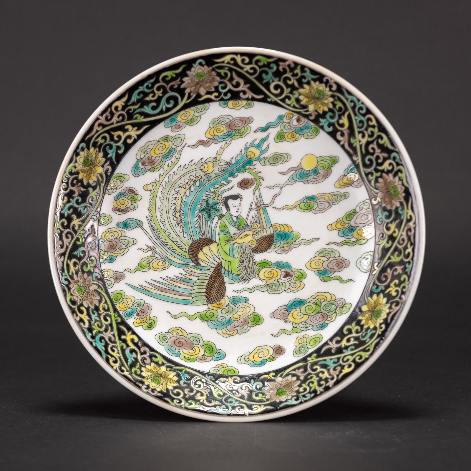 A FAMILLE-NOIRE 'FIGURAL' DISH, YONGZHENG MARK: A famille-noire 'figural' dish, Yongzheng mark. H4 x D21 cm